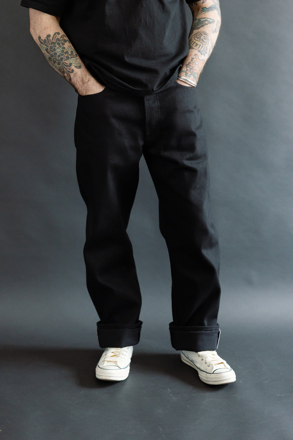 Front view, mid-body shot of a male model 5'9