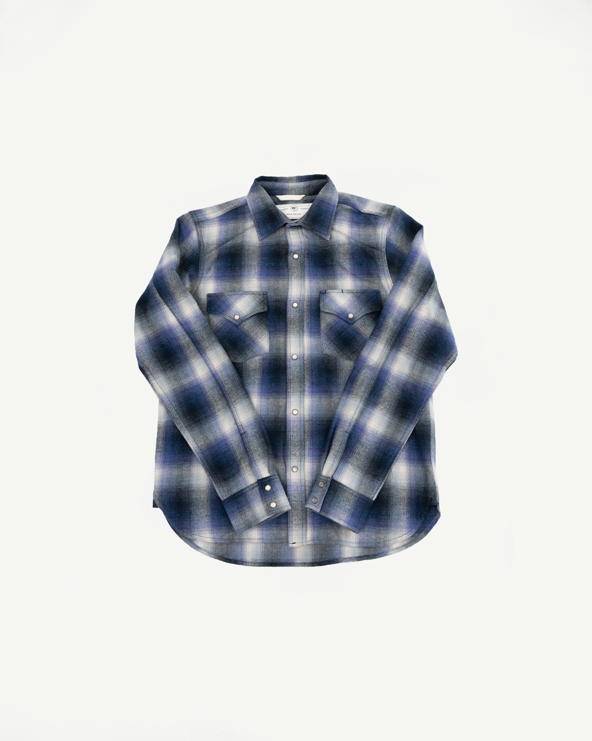 Front view flat lay of a blue and white plaid flannel shirt with chest pockets.
