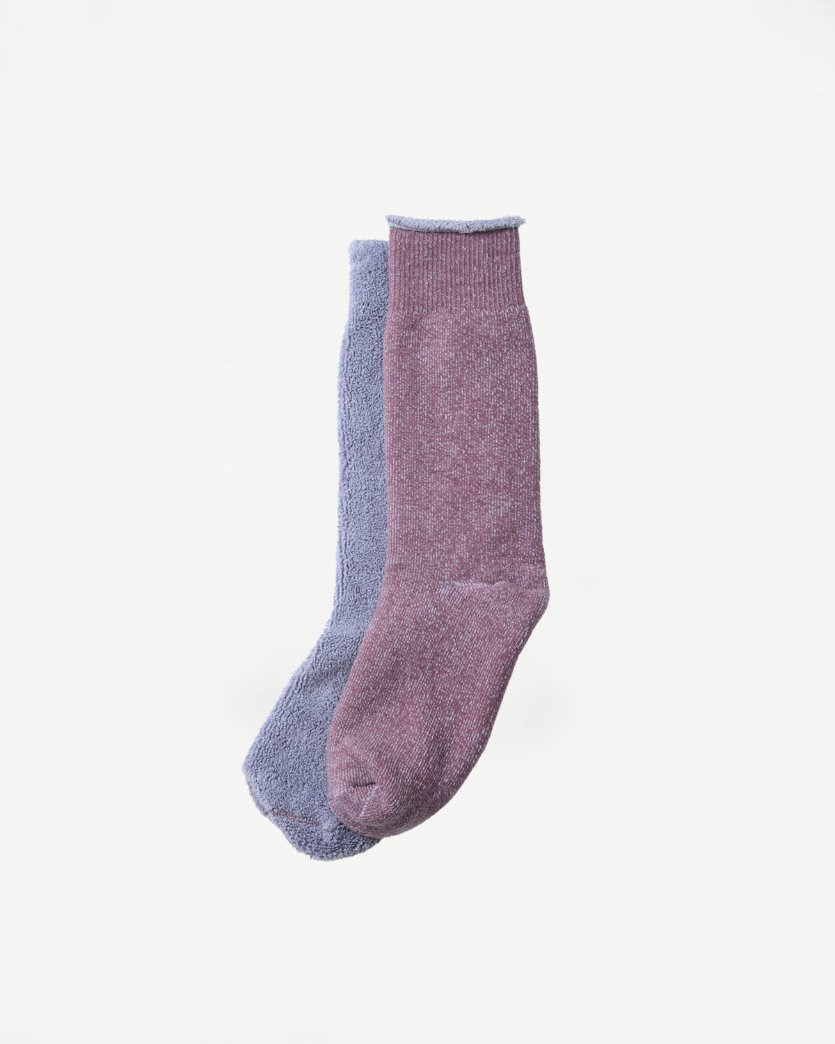 Flat lay front view of a pair of textured crew socks in lavender and dusty rose.