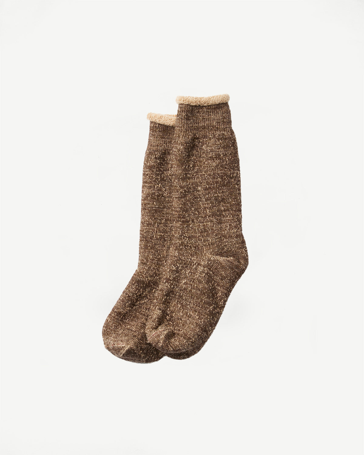 Close-up front view of a pair of brown textured knit socks with beige cuffs.