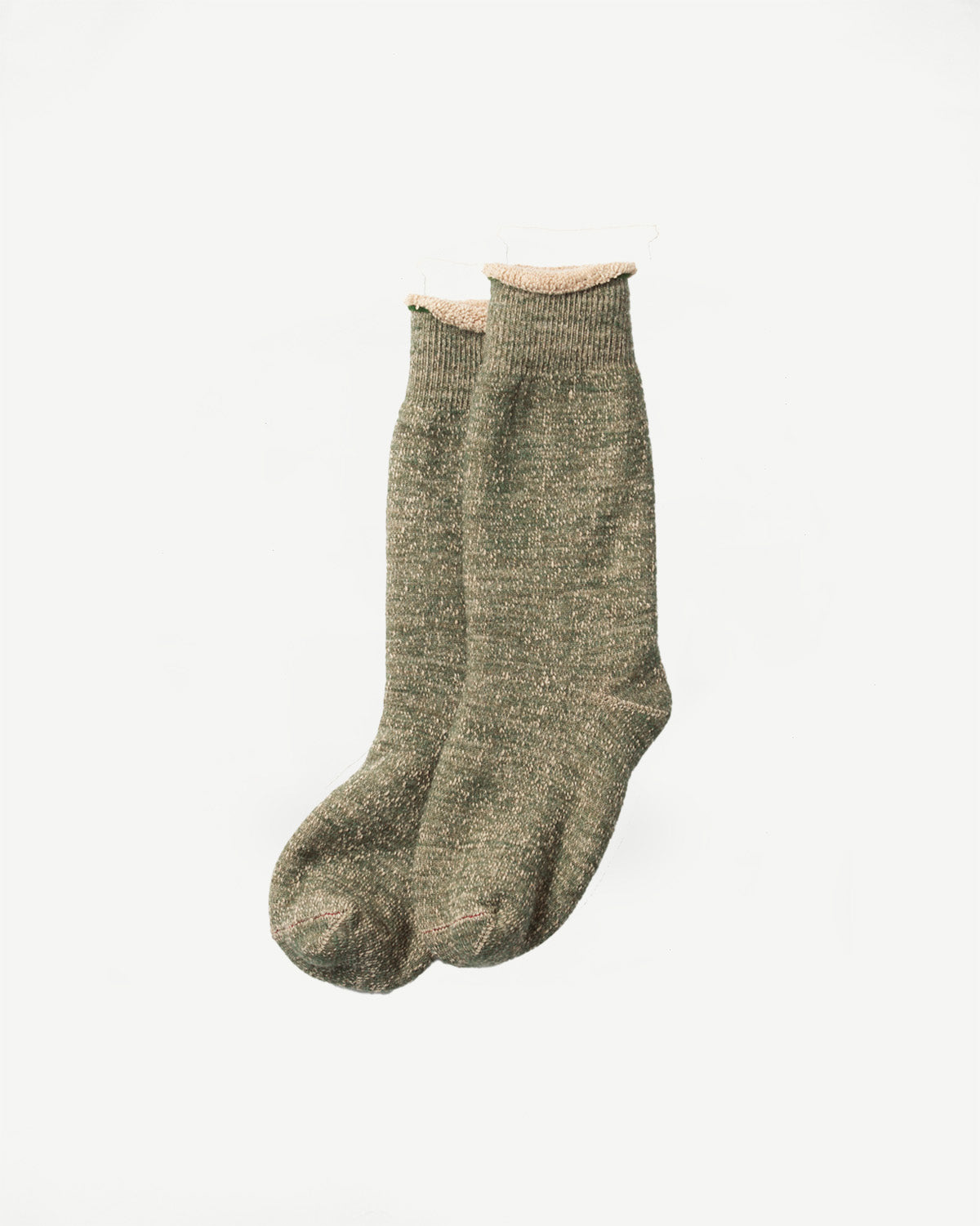 Close-up front view of a pair of textured, olive green marled knit socks hanging vertically.