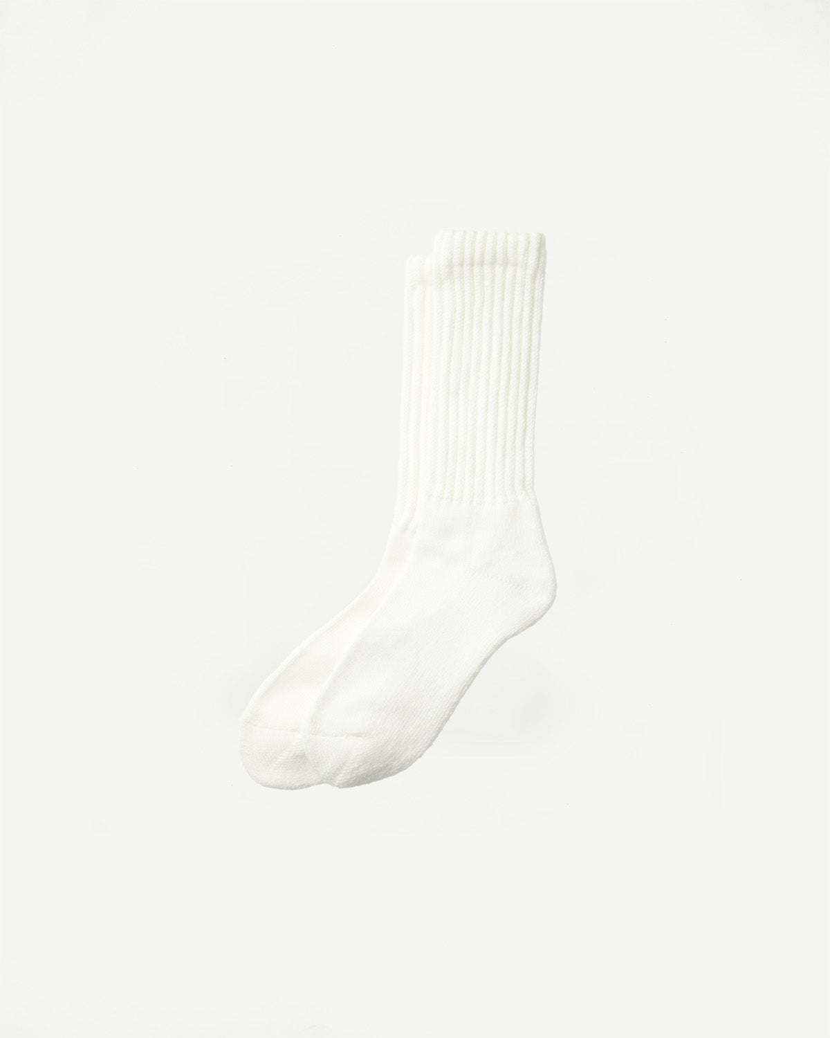 Flat lay front view of white crew sock with ribbed cuff and soft textured fabric.