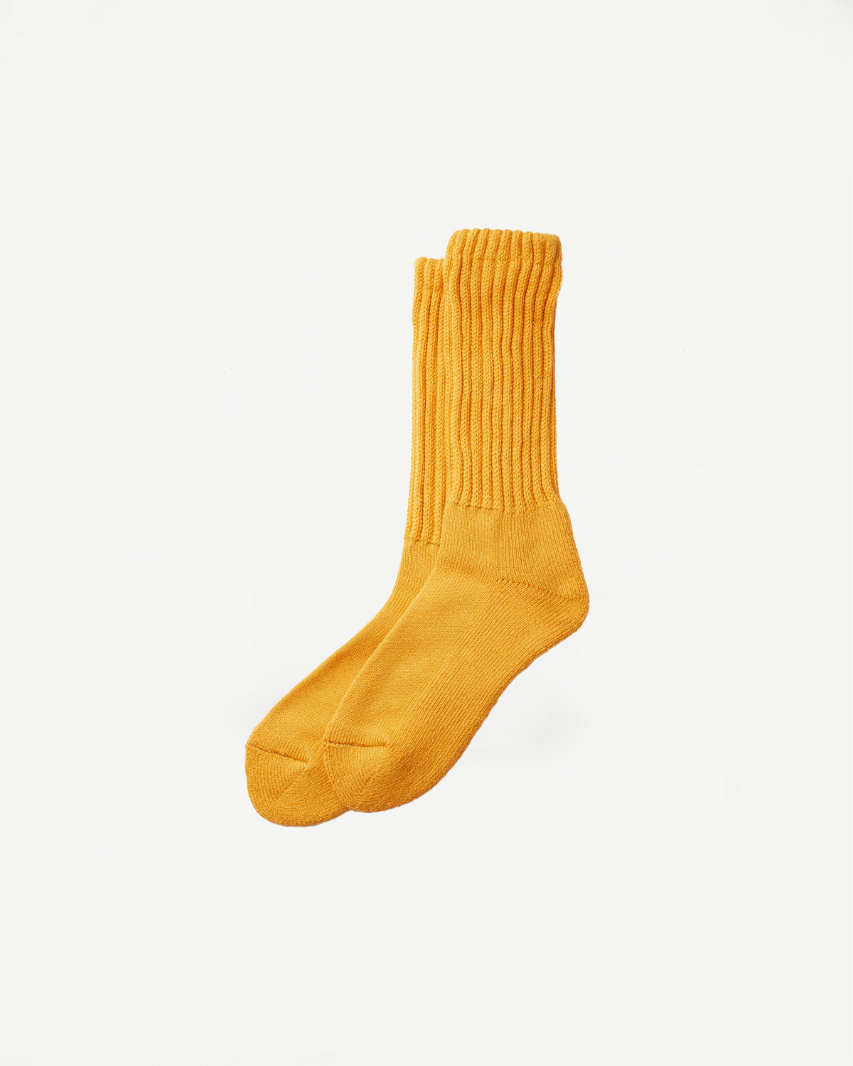 Flat lay front view of yellow crew socks, ribbed texture, full length visible.
