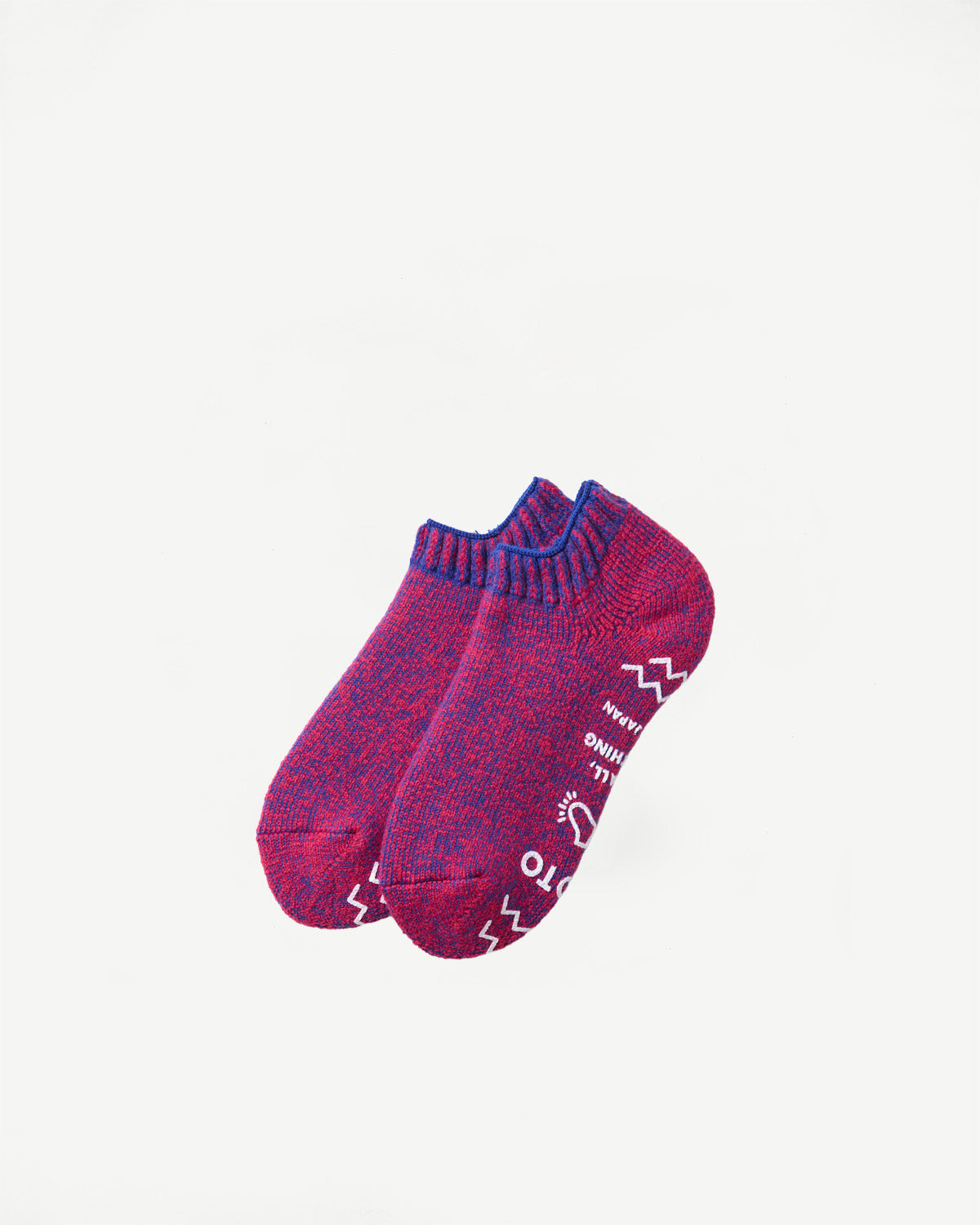 Flat lay, side view of heathered purple and pink socks with white graphic text on soles.