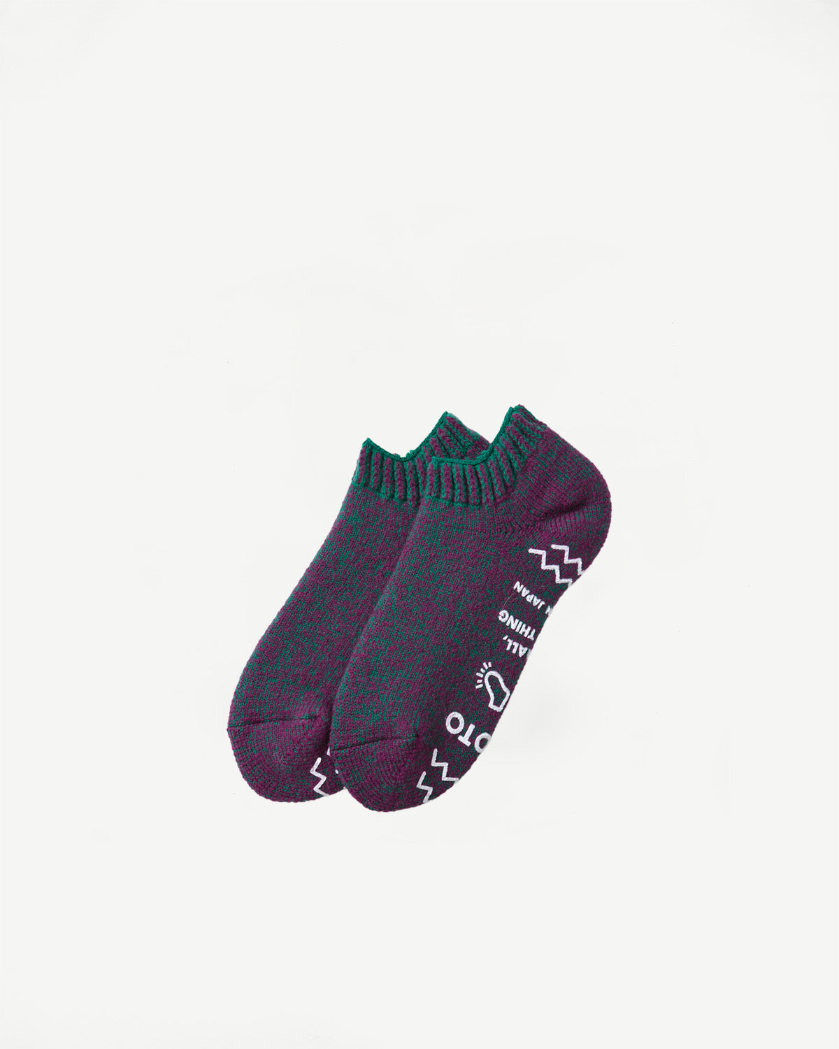 Flat lay, top view of purple and green heathered socks with white graphic text and symbols.