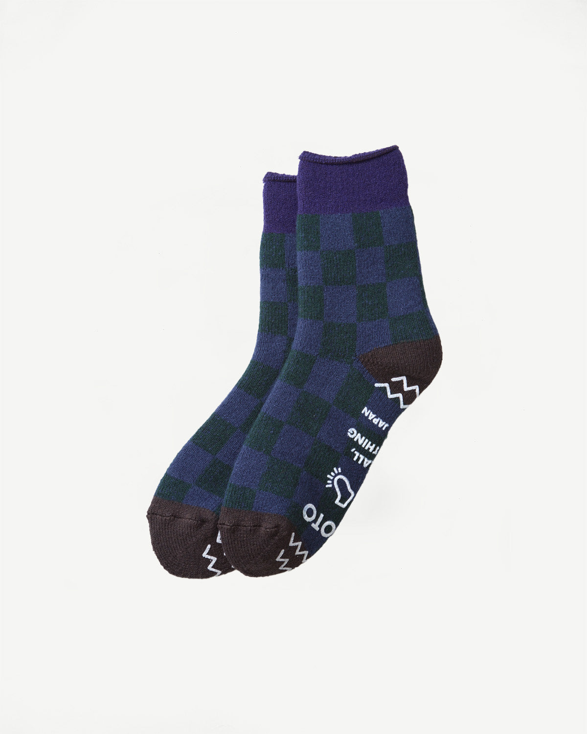 Close-up of the bottom and side of navy blue and dark blue checkered socks.