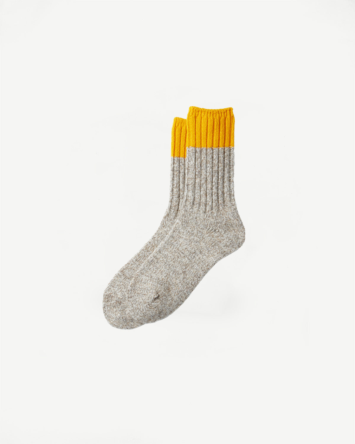 Front flat lay of Rototo merino wool rug socks in yellow and grey, ribbed texture, Dant shop