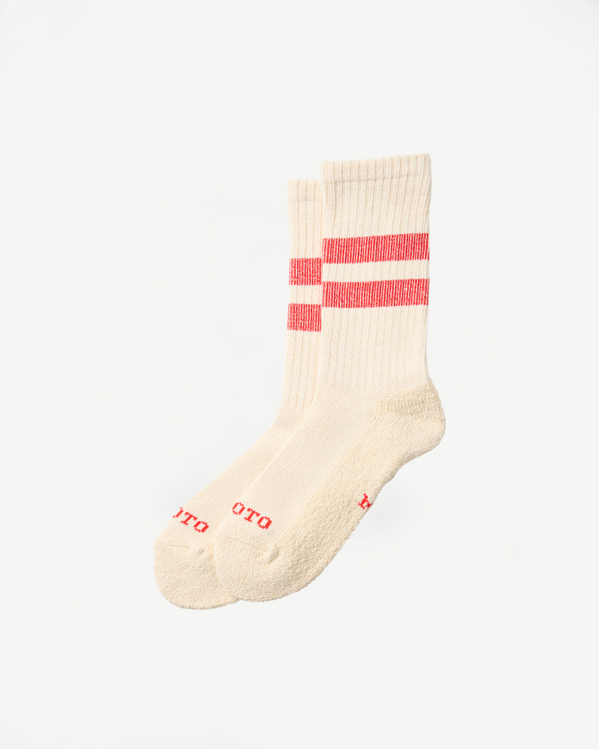 Flat lay of cream-colored crew socks with red stripes, showing the front and side views.