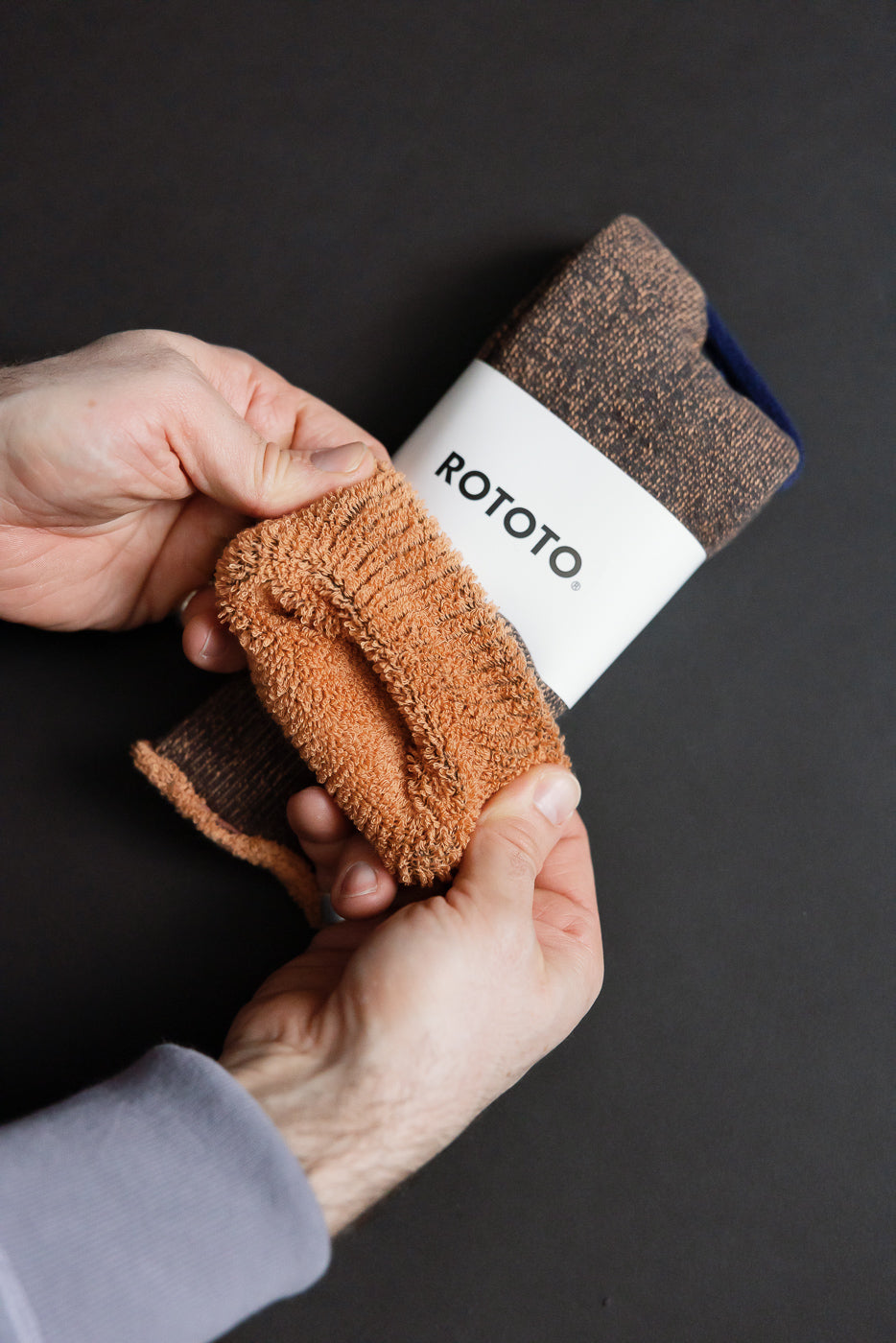 R1612 - Reversible Pile Socks - Faded Black, Light Orange: Thick terry-lined socks with a brown heather knit and plush orange-brown lining, showcasing reversible design inspired by 1970s college T-shirts, in premium menswear style.