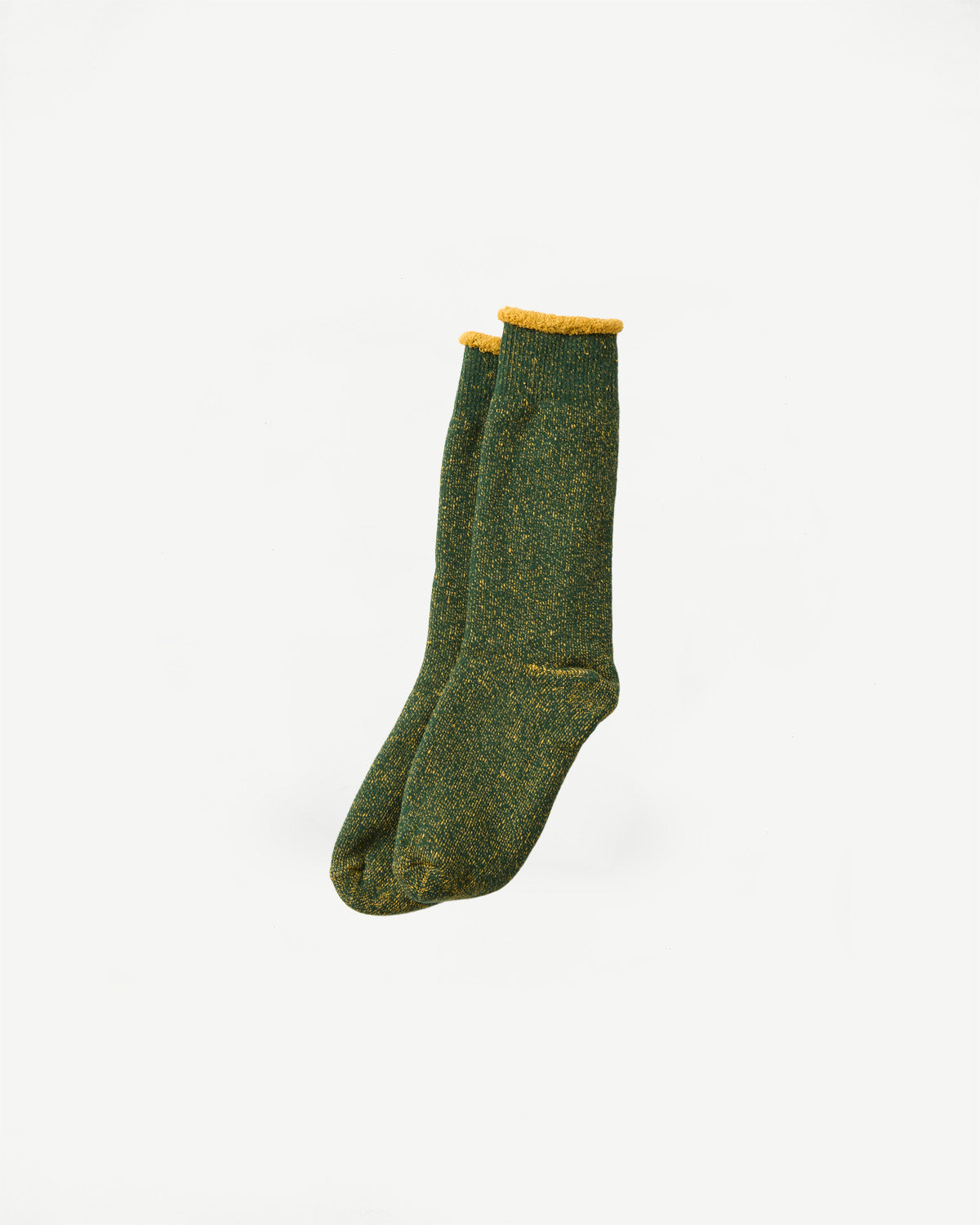 Flat lay front view of Rototo reversible pile socks in ivy green and dark yellow, close-up of full socks, textured knit, product for Dant contemporary casual apparel.