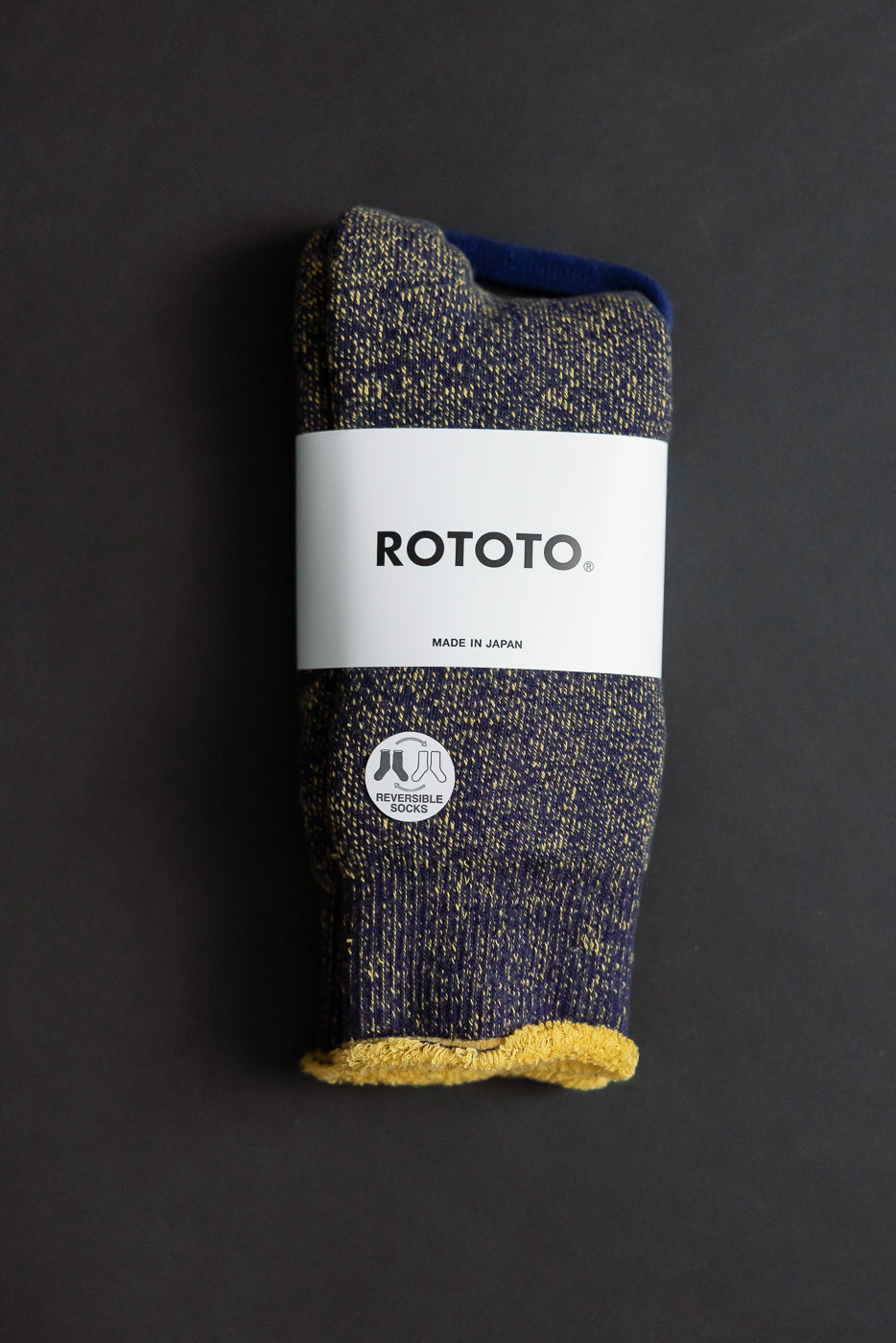 Reversible Pile Socks, style R1612, by ROTOTO, feature a blue-and-yellow speckle knit with a contrasting yellow terry lining, showcasing a two-tone design. Made in Japan, emphasizing comfort and versatility.