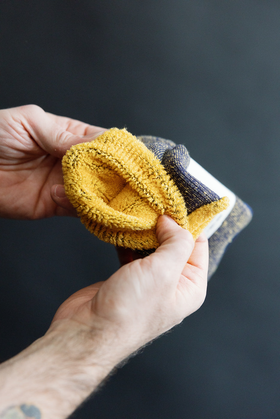 Close-up of interior texture of Rototo R1612 reversible pile socks navy yellow, showing detailed fabric and cuff.