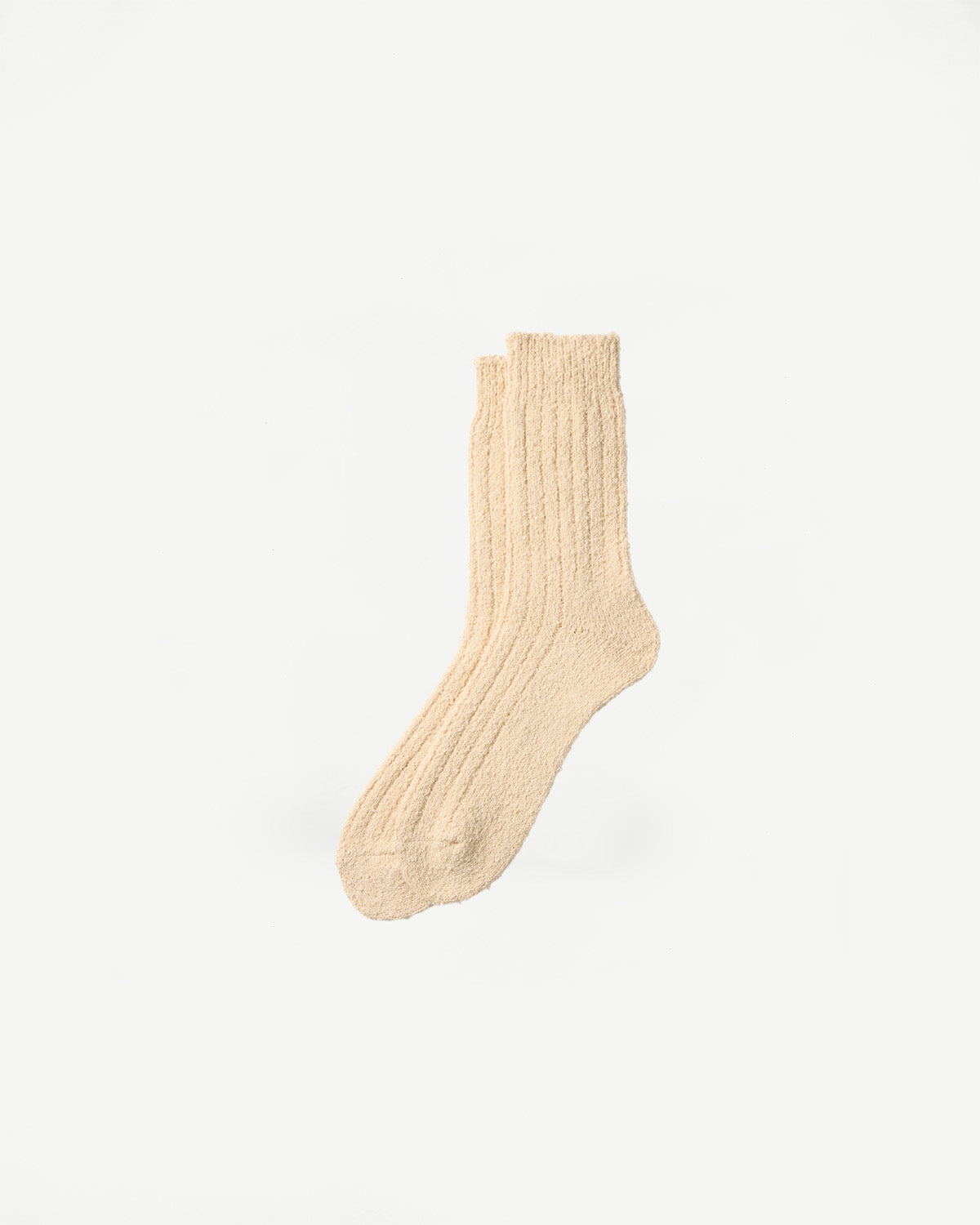 Front flat lay of ecru Rototo recycled cotton boucle crew socks showing ribbed texture