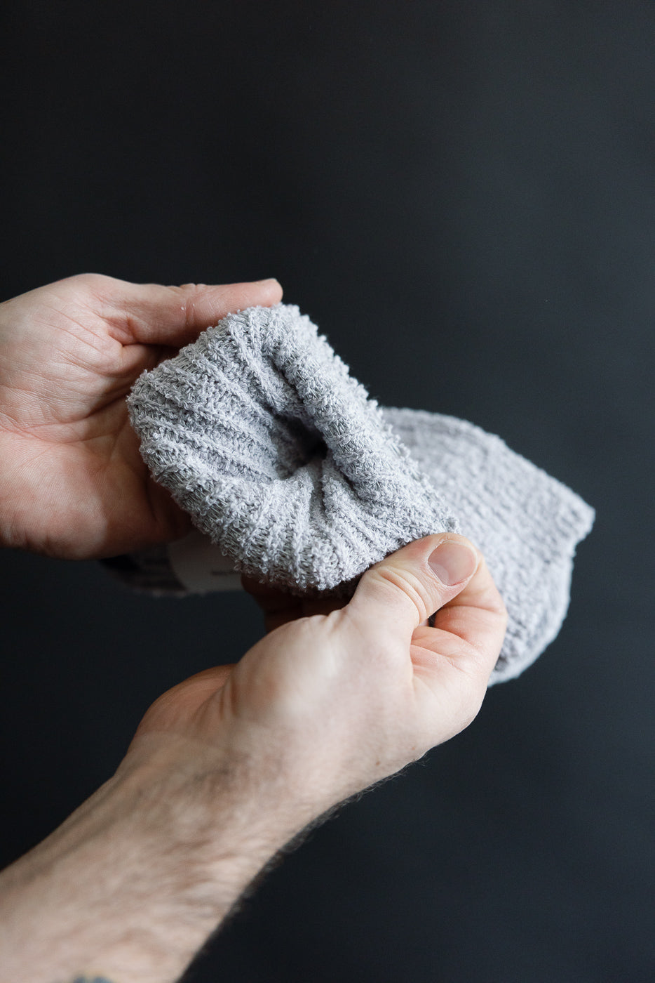 Close-up of pale blue recycled cotton crew sock cuff, showing boucle texture and ribbing.