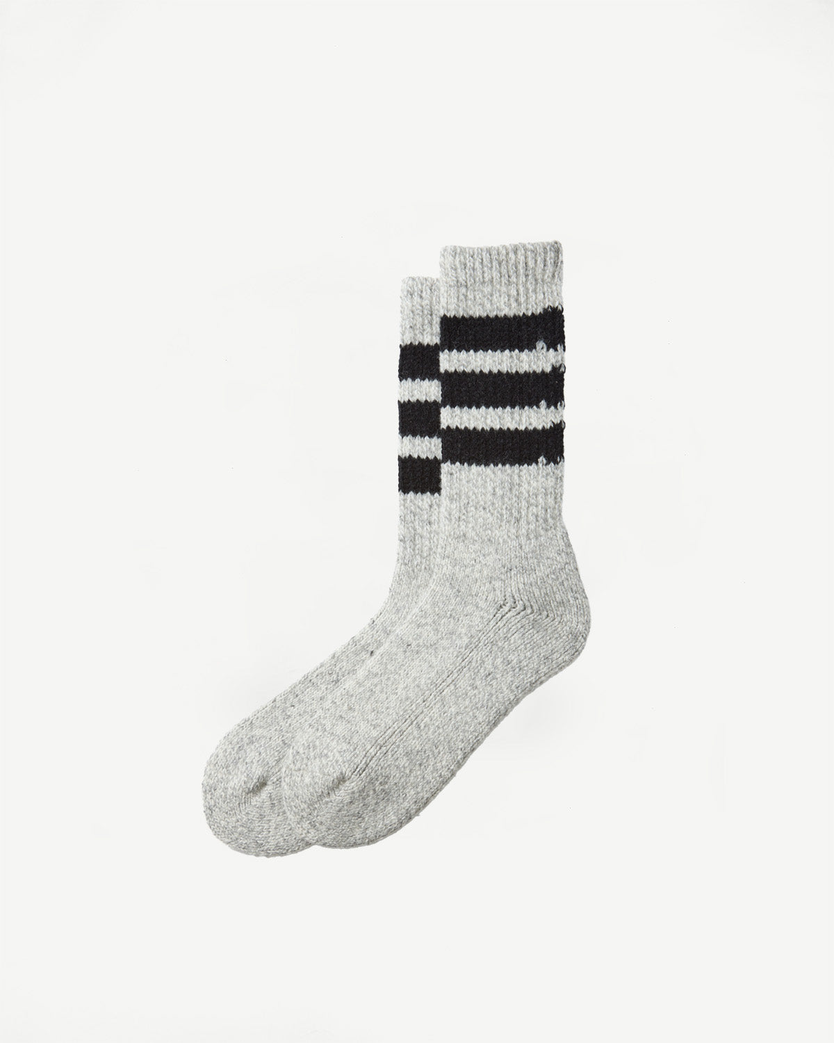 Close-up front view of grey crew socks with three black stripes at the top.