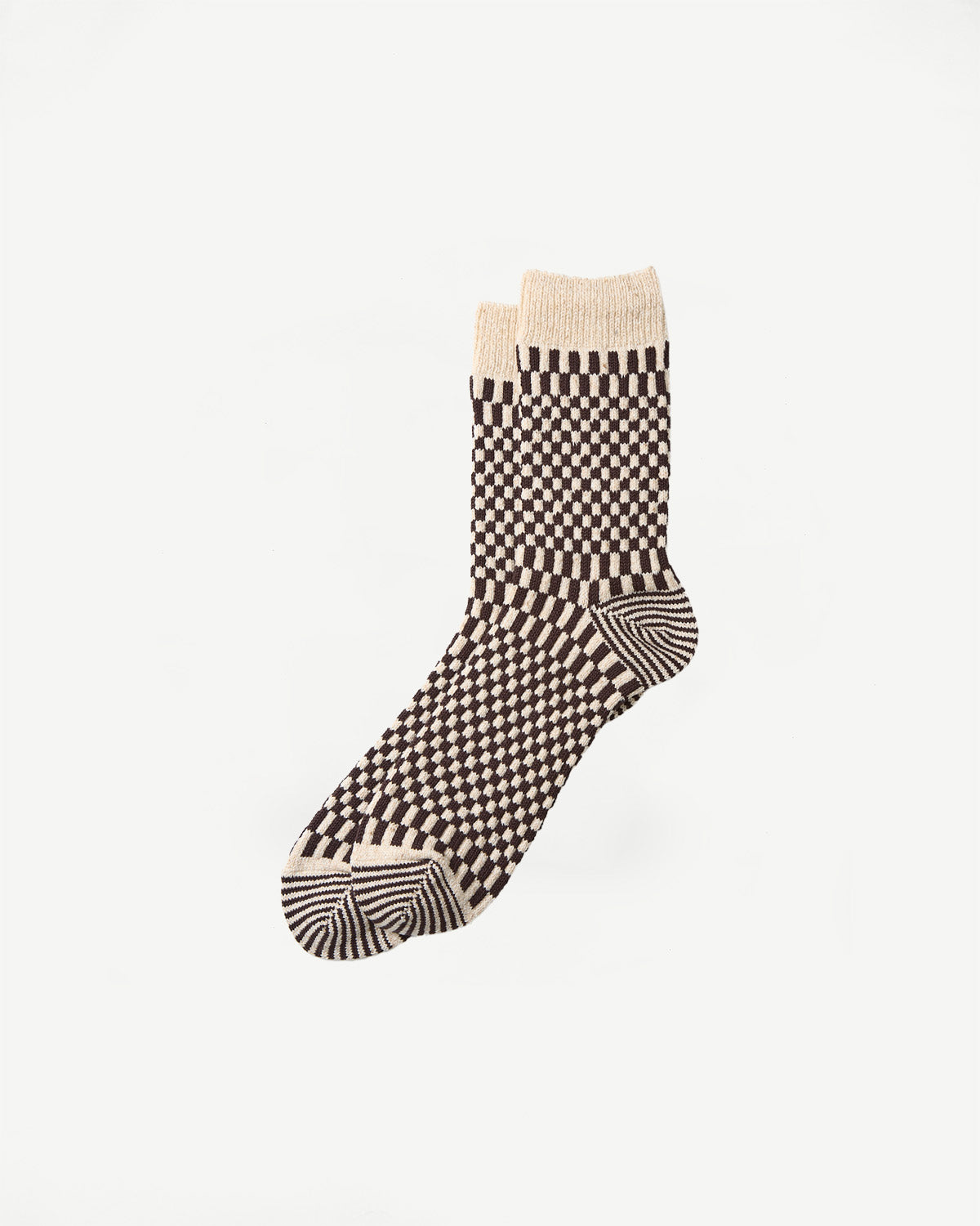 Flat lay front view of brown and beige checkerboard crew socks, showing full sock details.