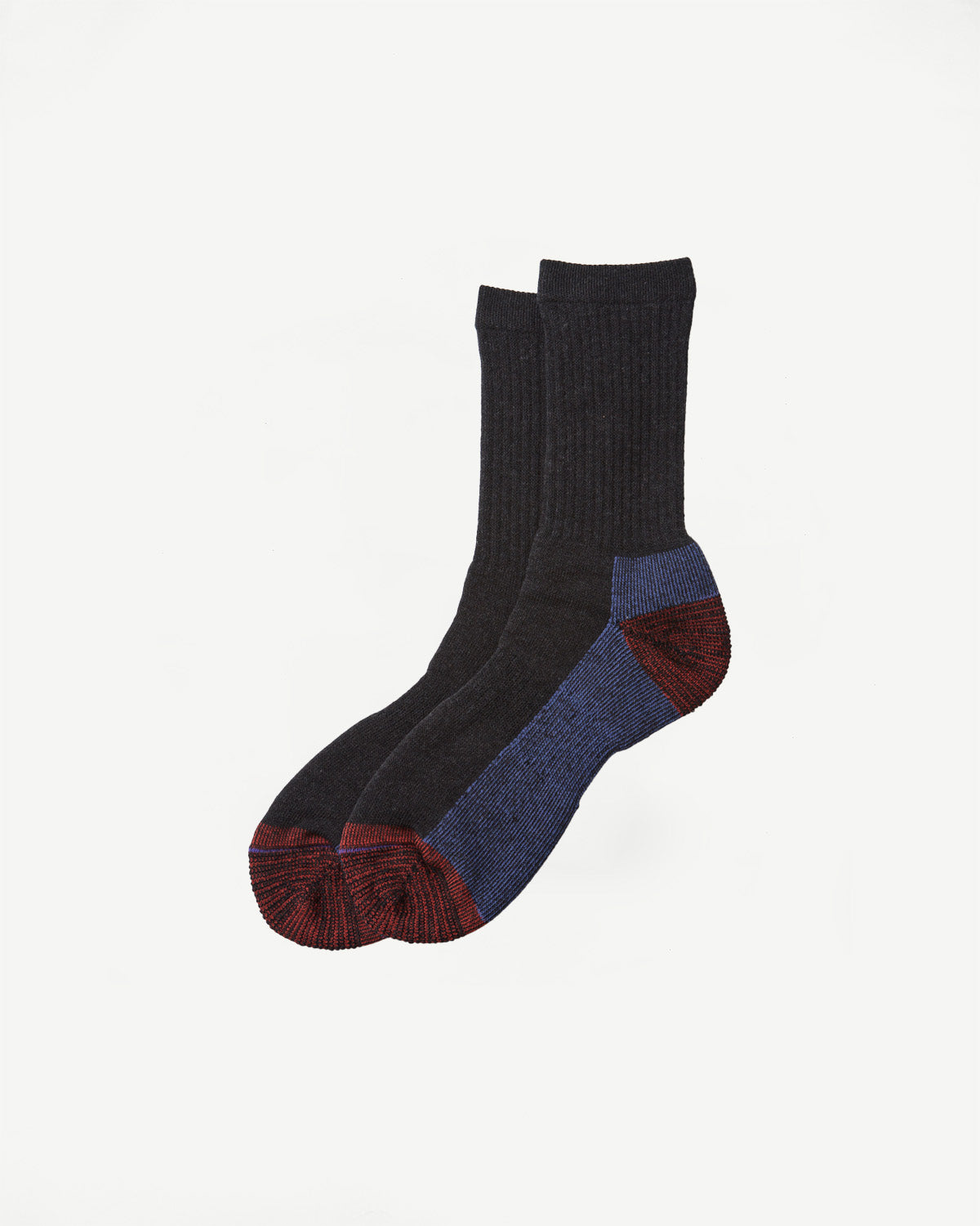 Flat lay, side view of charcoal grey crew socks with blue and red heel and toe details.