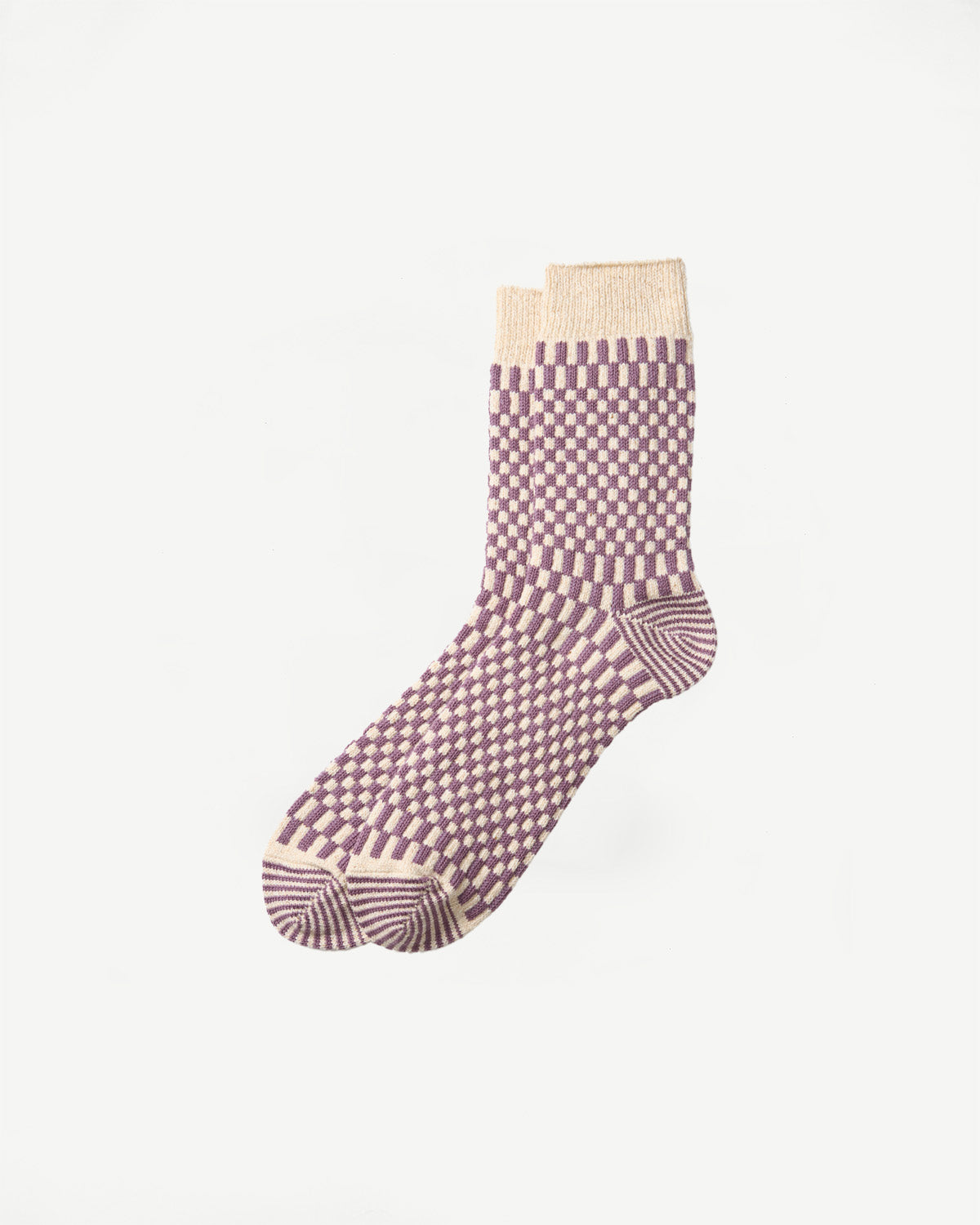 Side view flat lay of purple and cream checkered patterned crew socks.