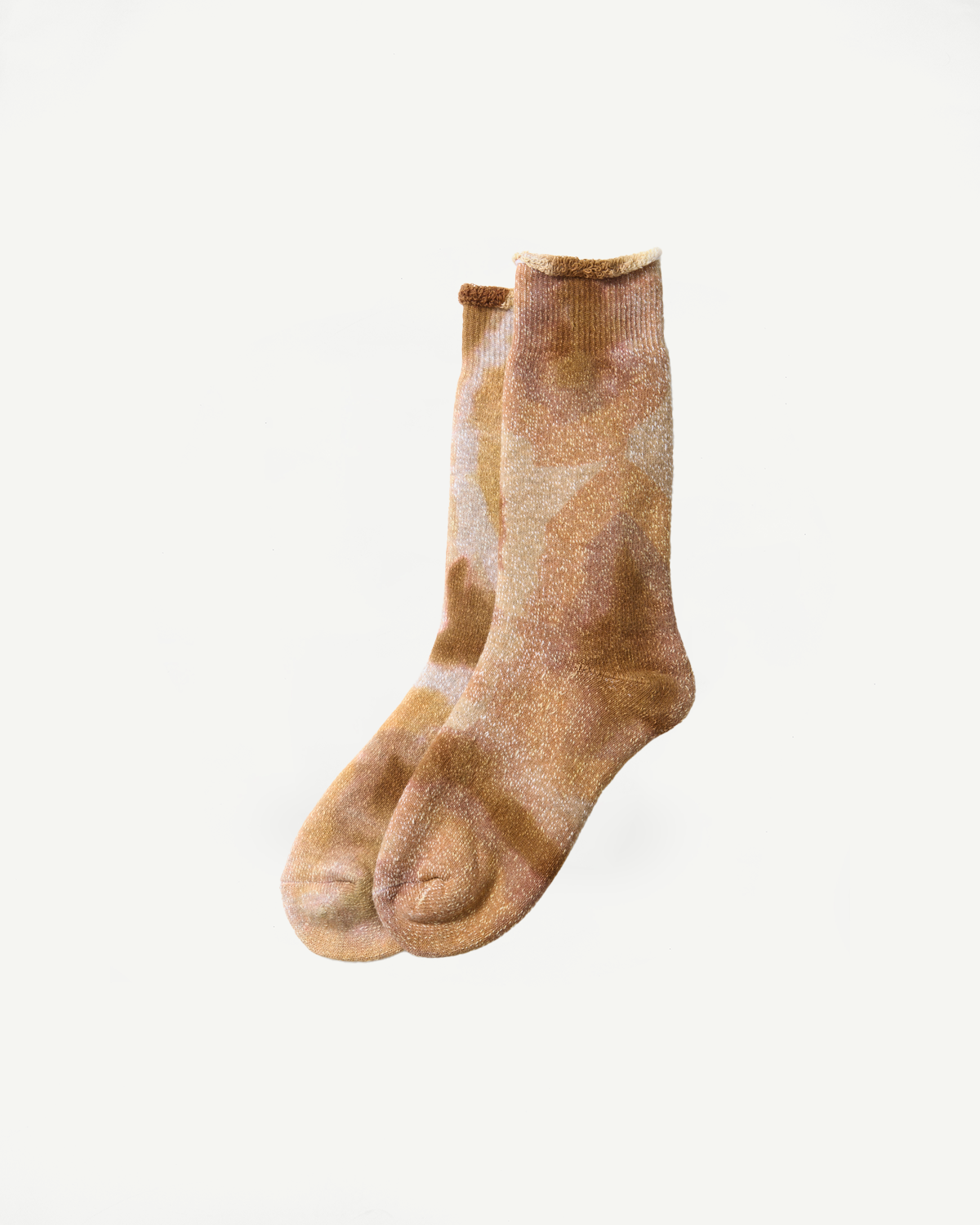 Flat lay front view of beige and brown tie-dye crew socks, showing full length and texture.