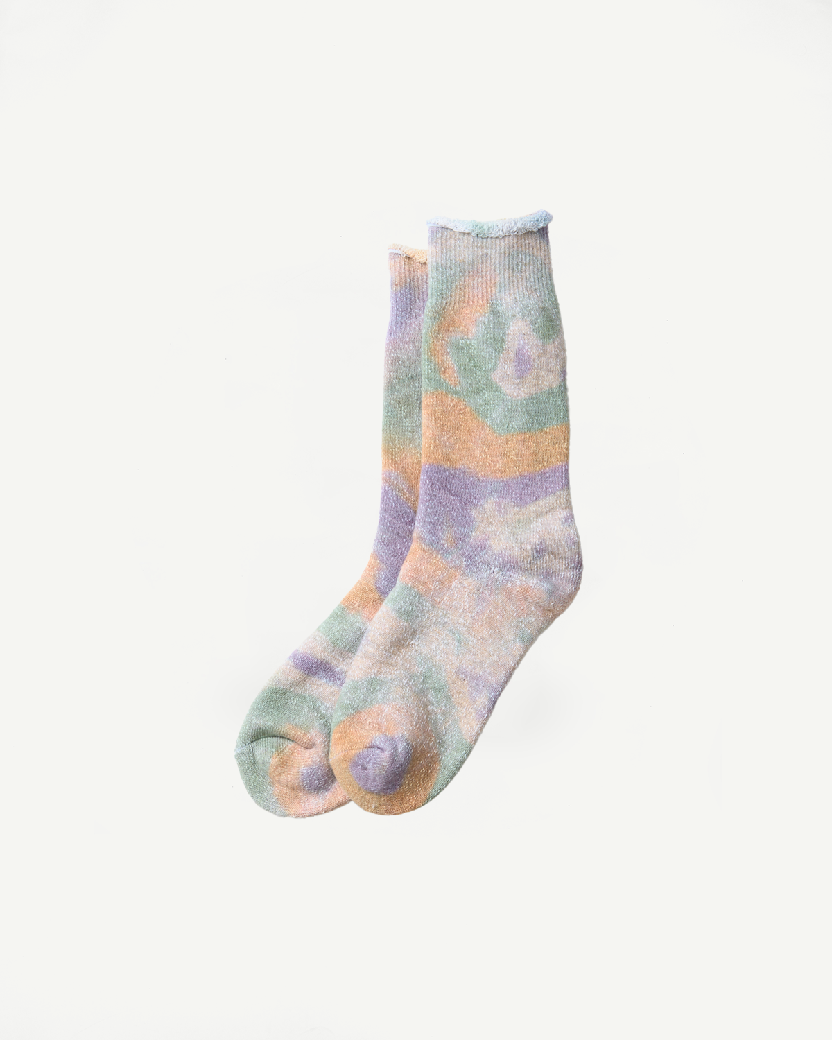 Flat lay front view of tie-dye crew socks in green, light pink and purple on white background.