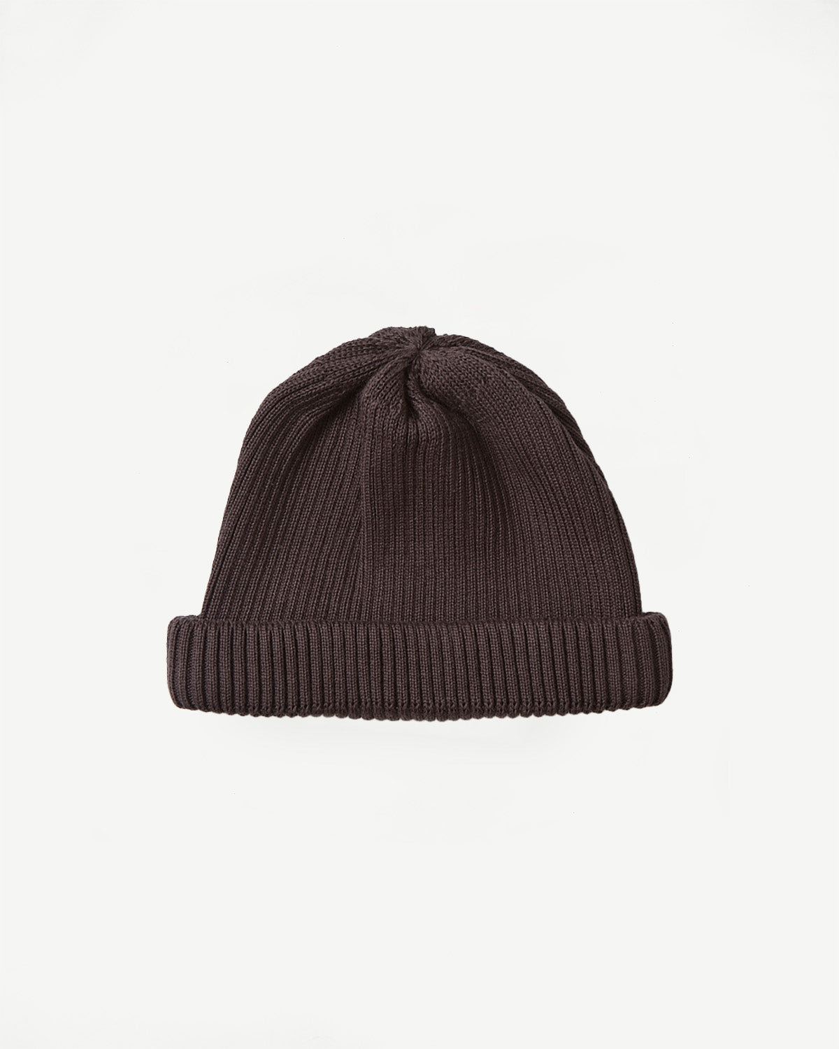 Flat lay, front view of dark brown cotton roll-up beanie showing ribbed knit texture.
