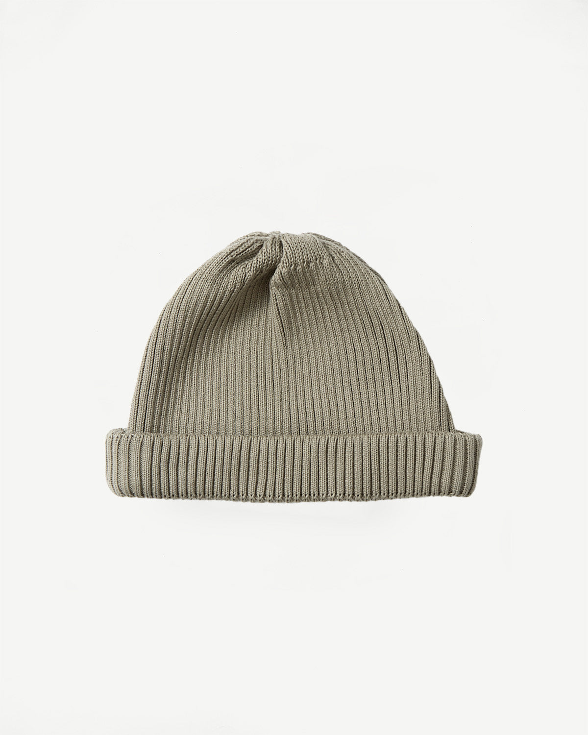 Flat lay front view of sage cotton roll-up beanie, ribbed knit texture visible.