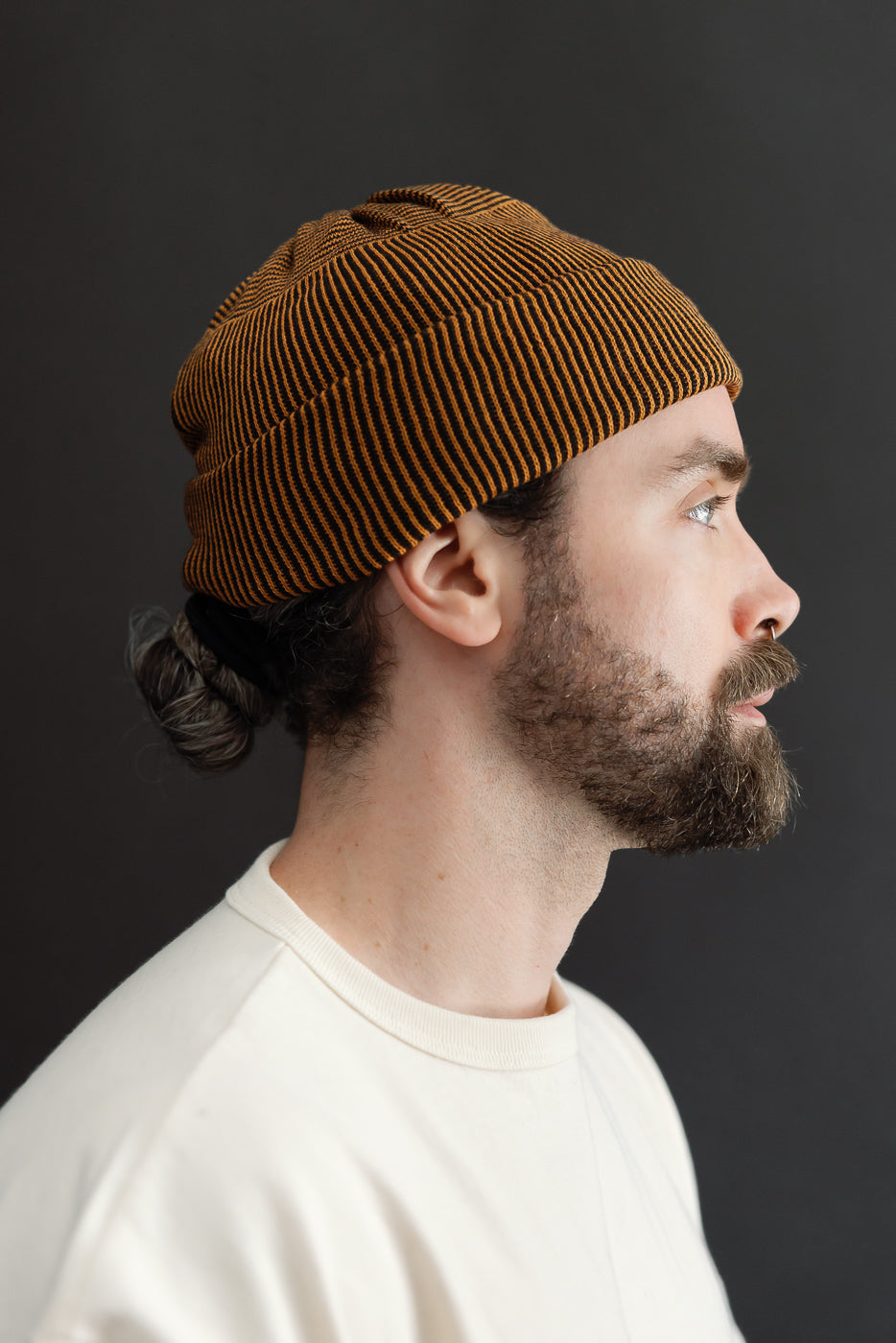 Close-up side view of a male model (5'9