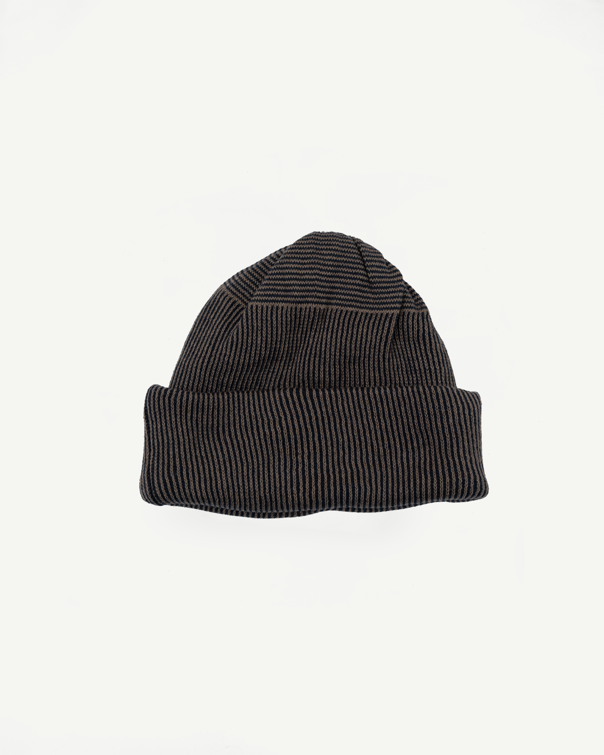 Front view flat lay of a black and brown ribbed knit beanie hat.