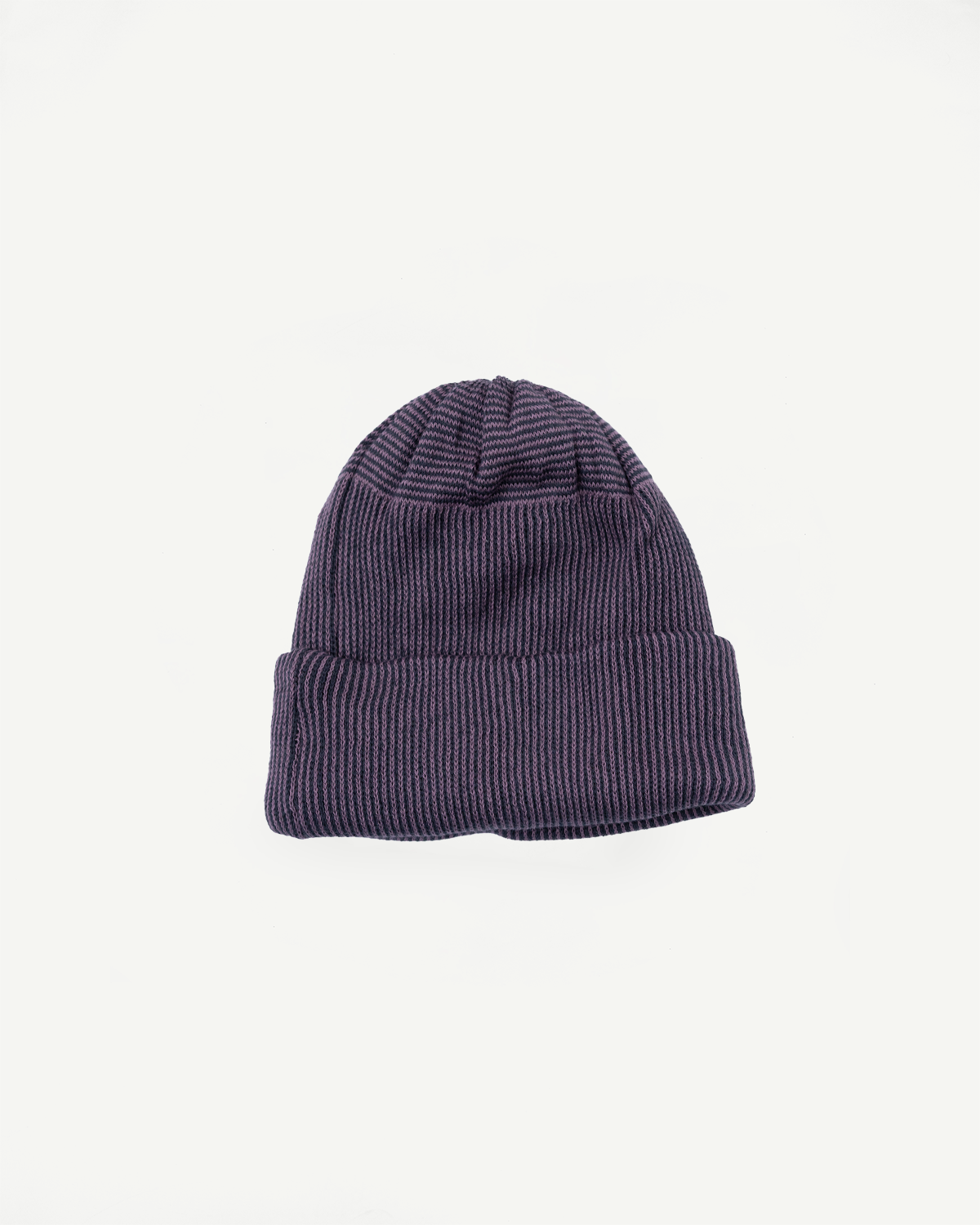 Front view flat lay of a ribbed knit purple beanie showing fabric texture.