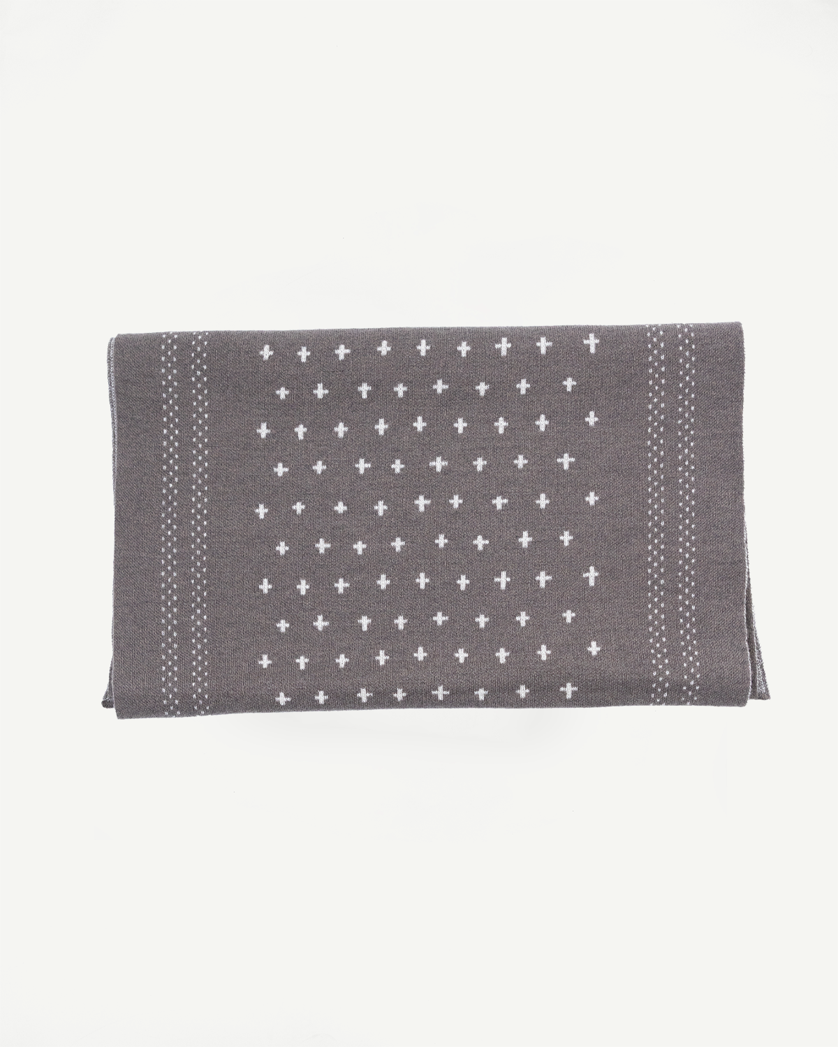 Flat lay, front view of a grey patterned fabric swatch with white cross motifs.
