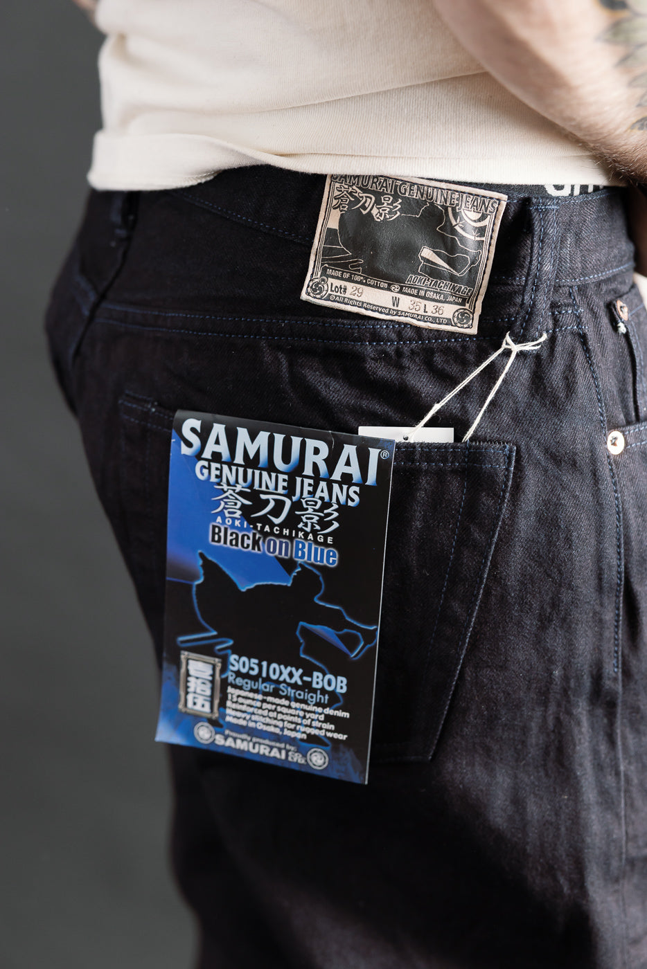 Close-up of back right side of Samurai S0510XX-Bob Black on Blue selvedge denim on male model, 5'9