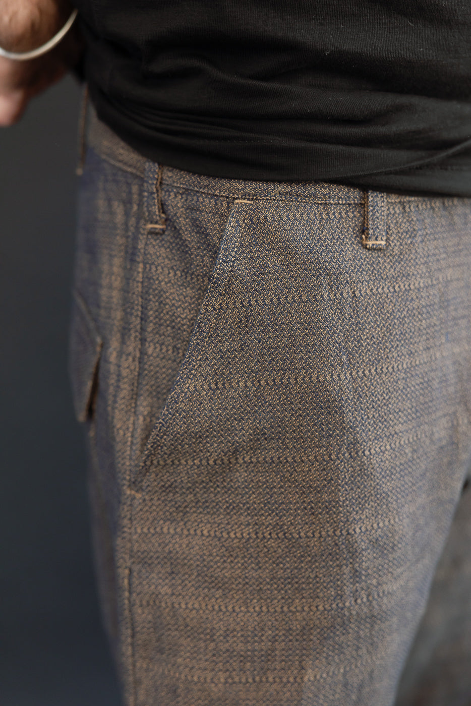 Close-up front view of selvedge chinos on male model, 5'9