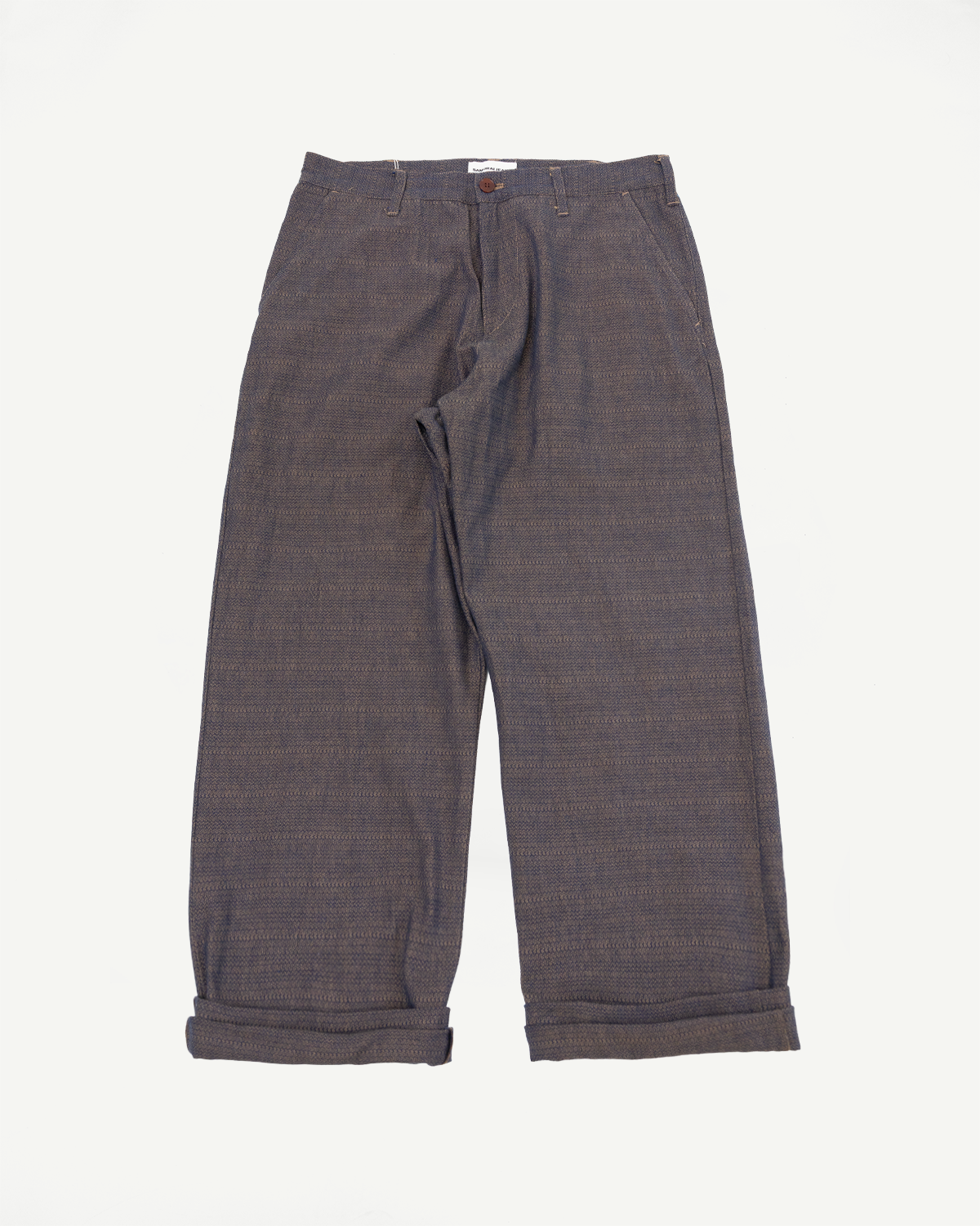 Flat lay front view of men's wide-leg trousers with cuffed hems, textured fabric, and button waistband