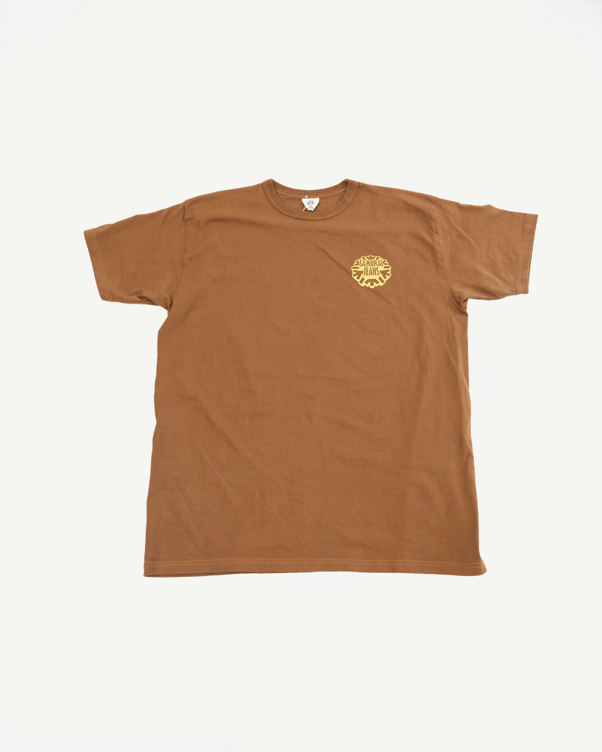 Brown short-sleeve tee, front view, featuring small yellow 'Samurai Jeans' chest logo, ribbed crew neck, and clean hem.