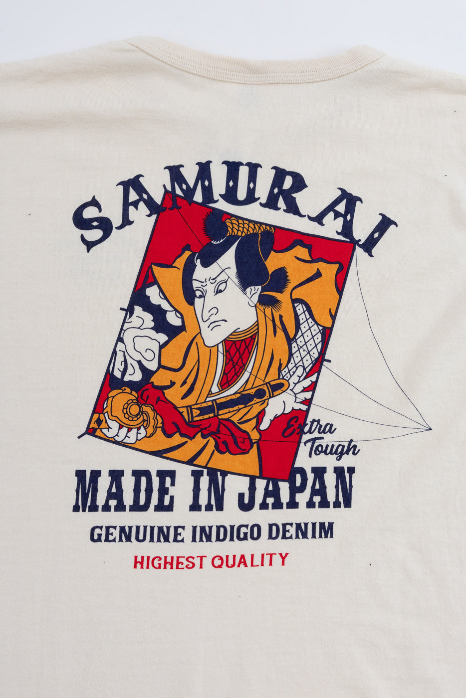 Back view close-up of cream t-shirt with Samurai graphic, 'Made in Japan' text, indigo denim print detail