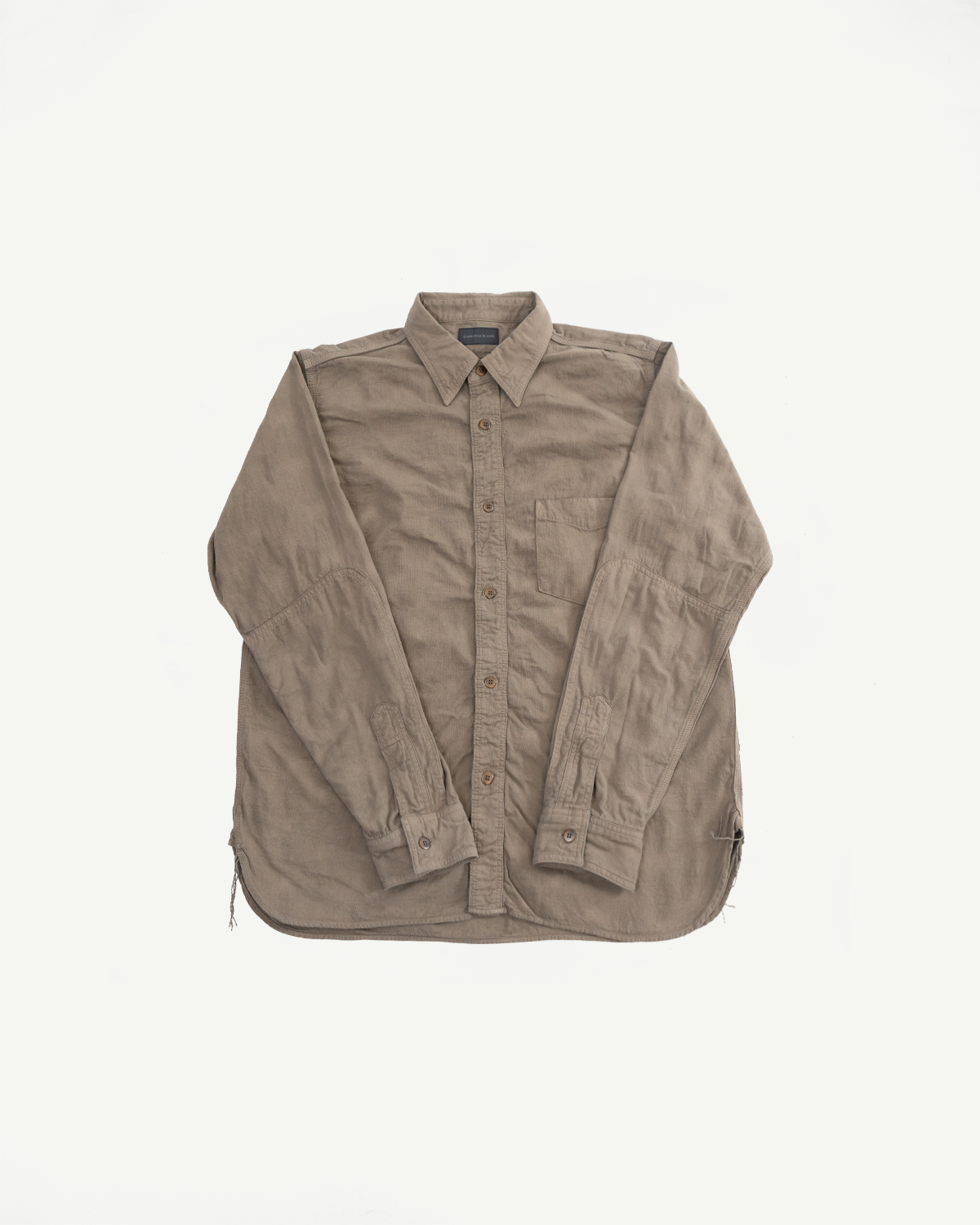 Front flat lay of beige button-up shirt with chest pocket, rolled sleeves, and frayed hem