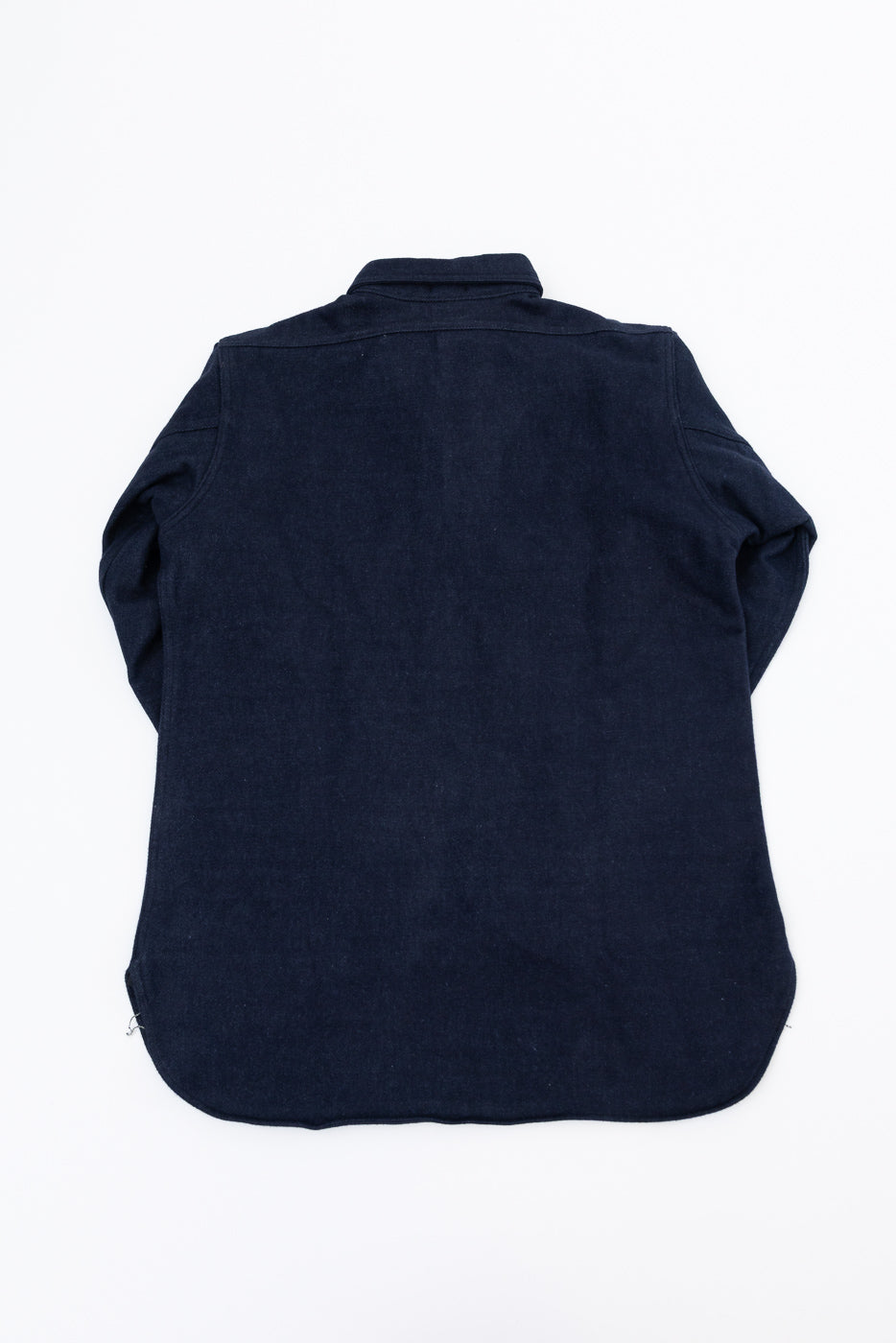 Back view of navy shirt, flat lay, showcasing collar and hem details