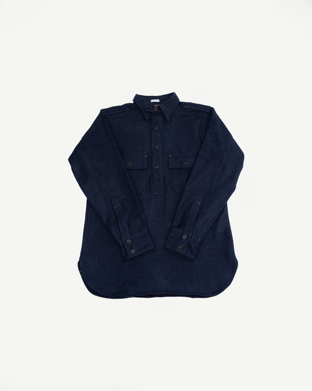 Front flat lay of navy corduroy shirt with buttoned cuffs, chest pockets, and collar detail.