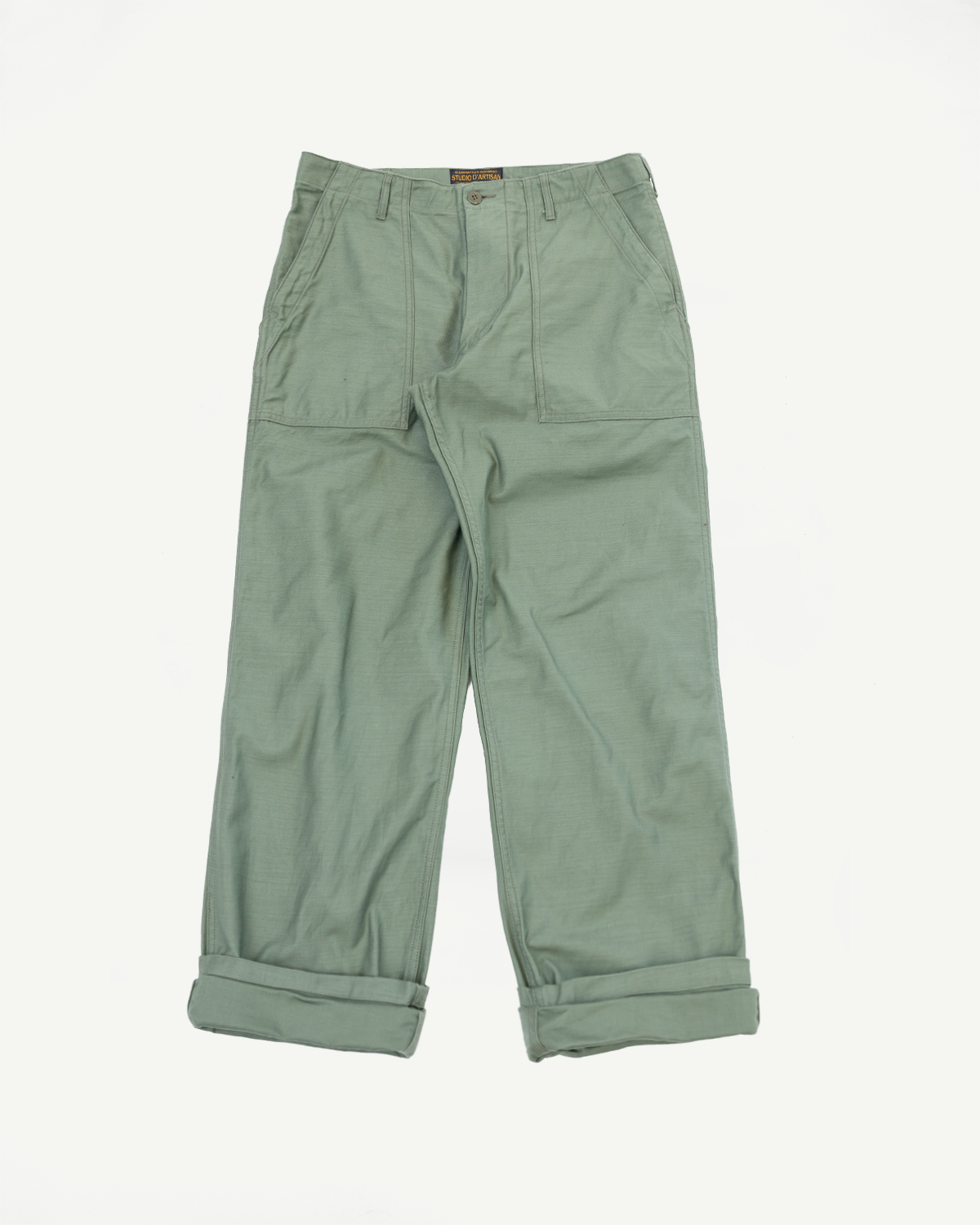 Front view of olive green cargo pants with rolled cuffs, flat lay