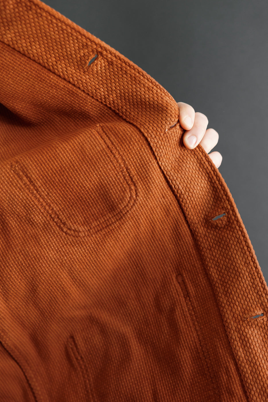Close-up of the back right side showing the textured corduroy fabric and pocket detail.