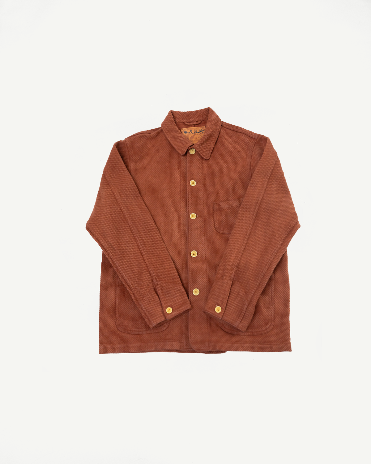 Front view flat lay of a brown textured corduroy button-up shirt with a chest pocket.