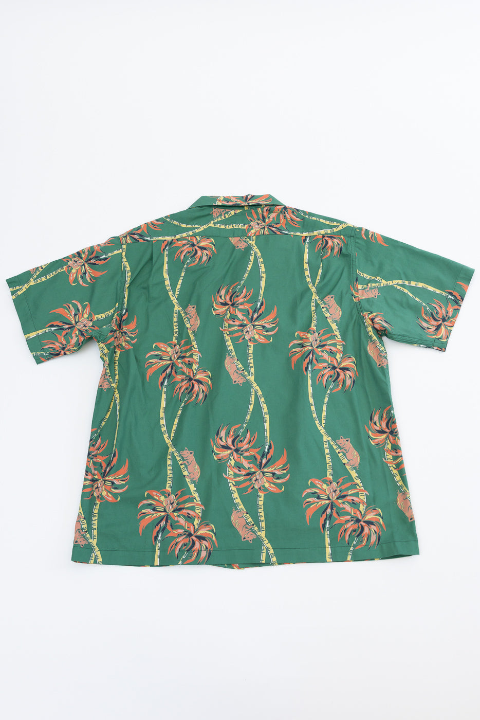 Back view of green short-sleeve camp shirt with palm tree print, flat lay