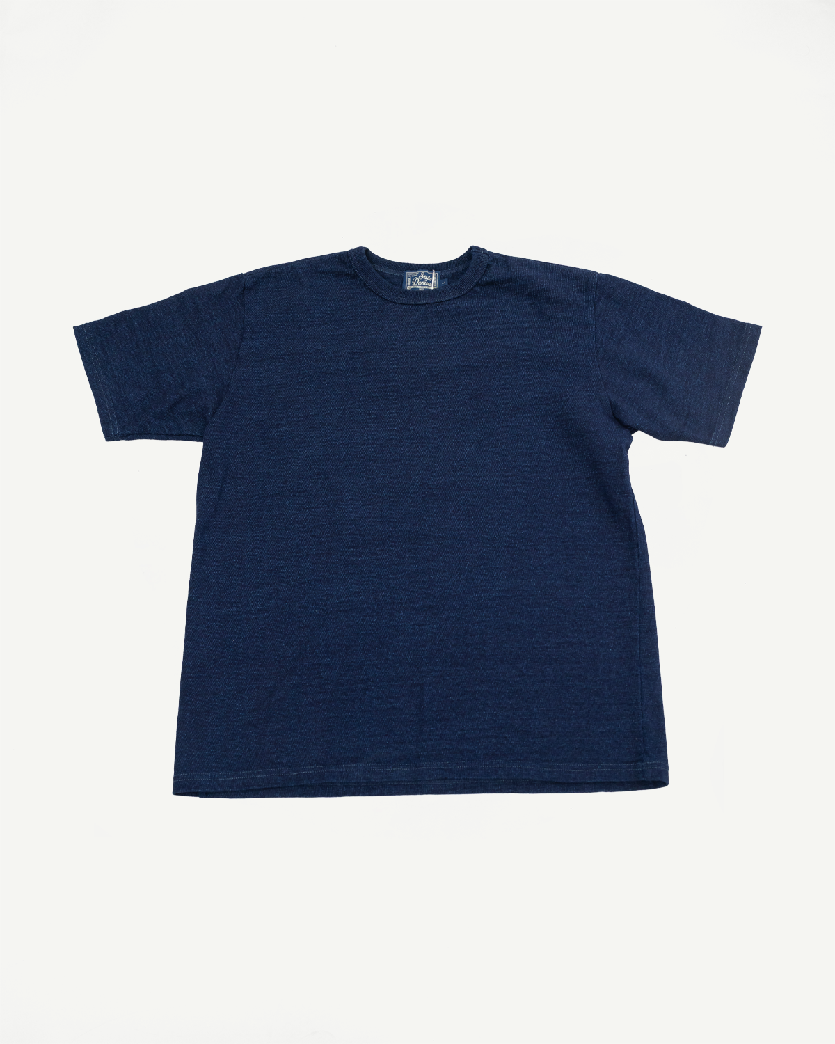 Navy blue short-sleeve tee, front view flat lay. Ribbed crew neck, clean hem, visible tag at collar.
