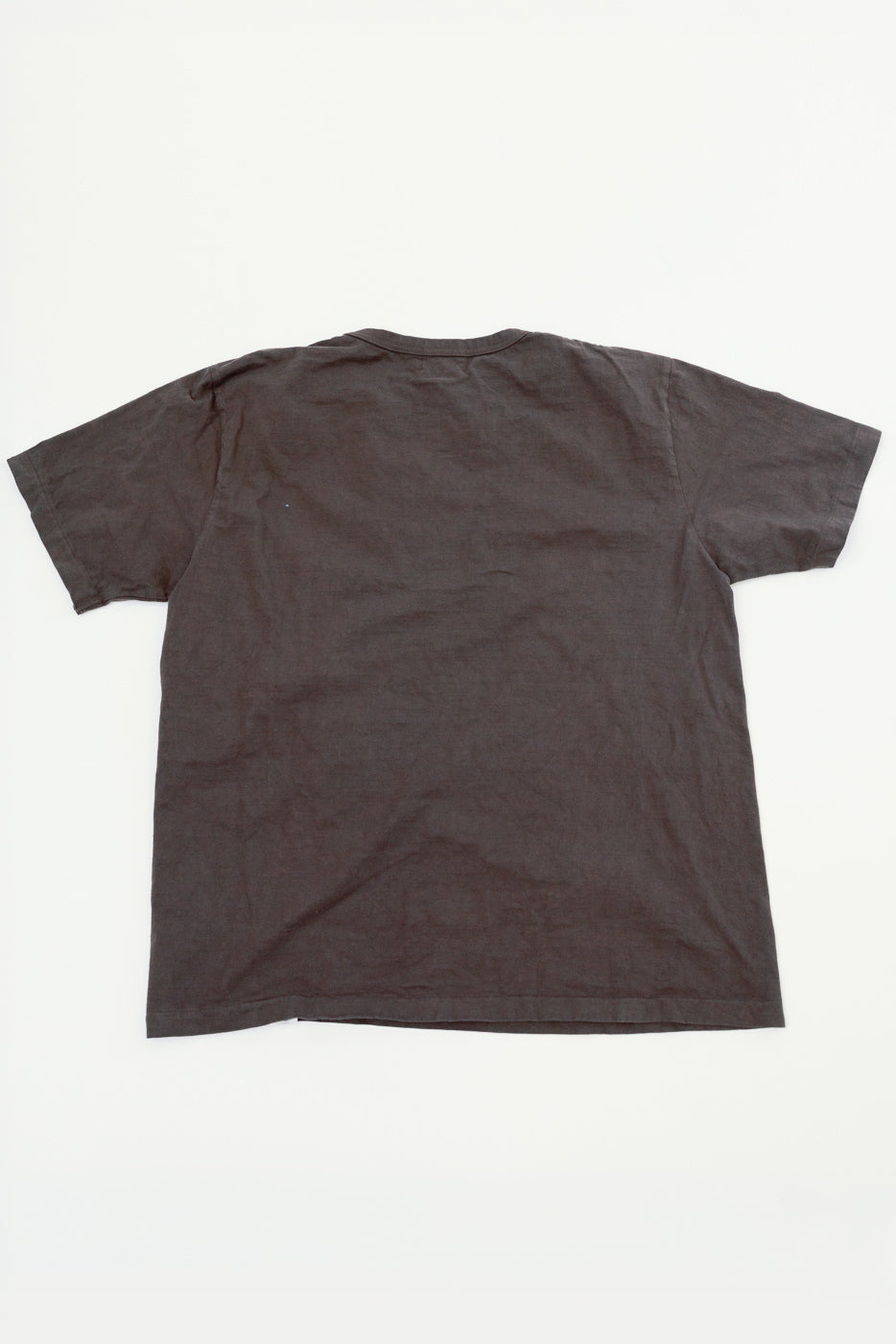 Back view of dark gray short-sleeve t-shirt, flat lay, showing hem and fabric texture