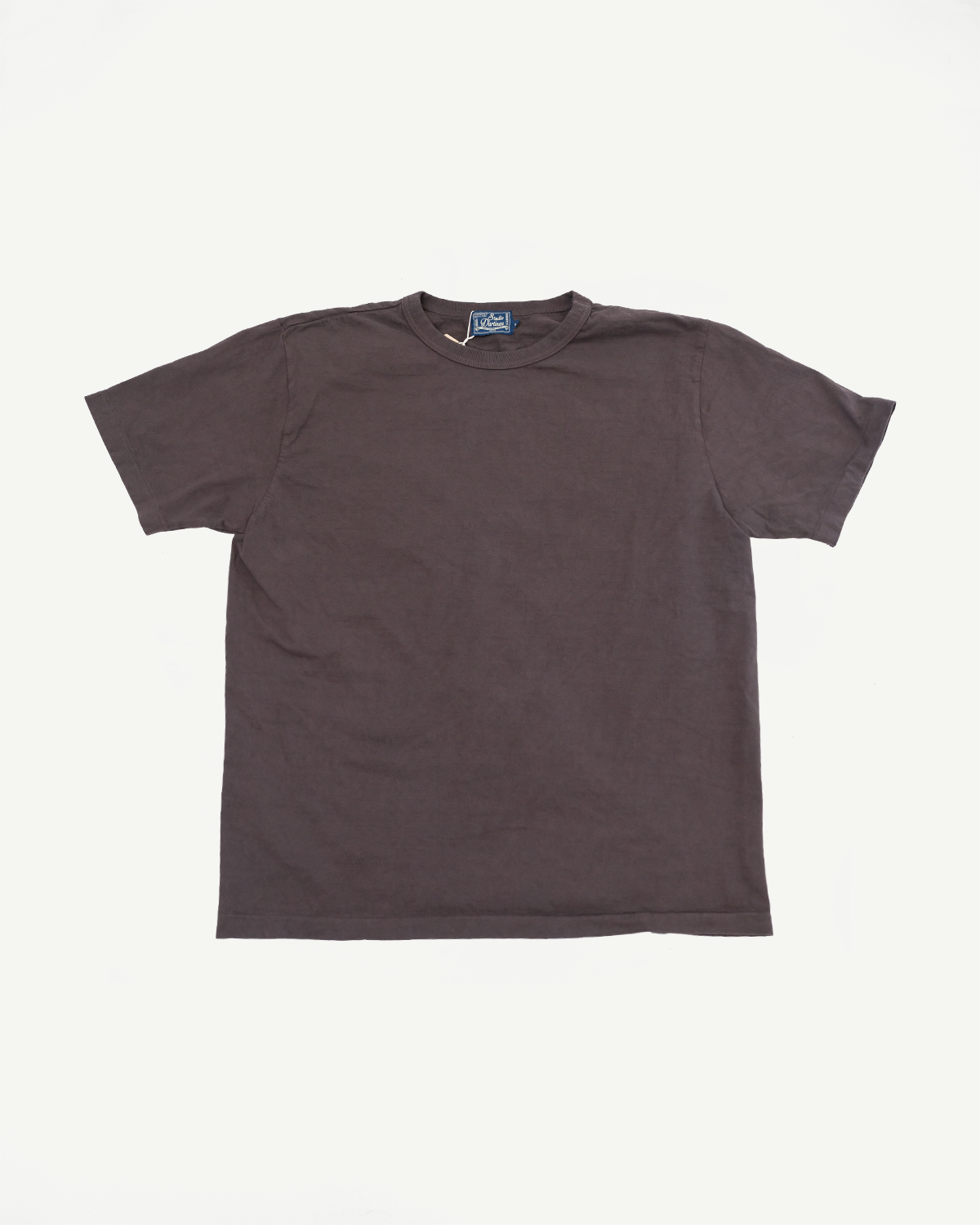 Dark brown crew neck t-shirt flat lay, front view, showing ribbed collar and blue brand tag