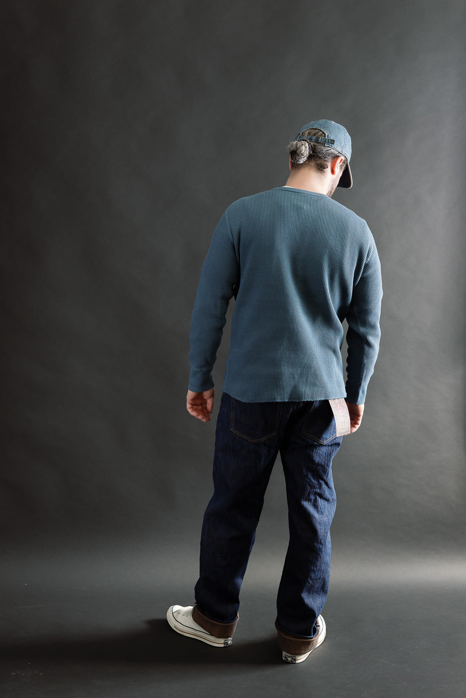 Male model 5'9 165lbs athletic build wearing Studio D’Artisan blue heavy thermal long sleeve henley, full body back view