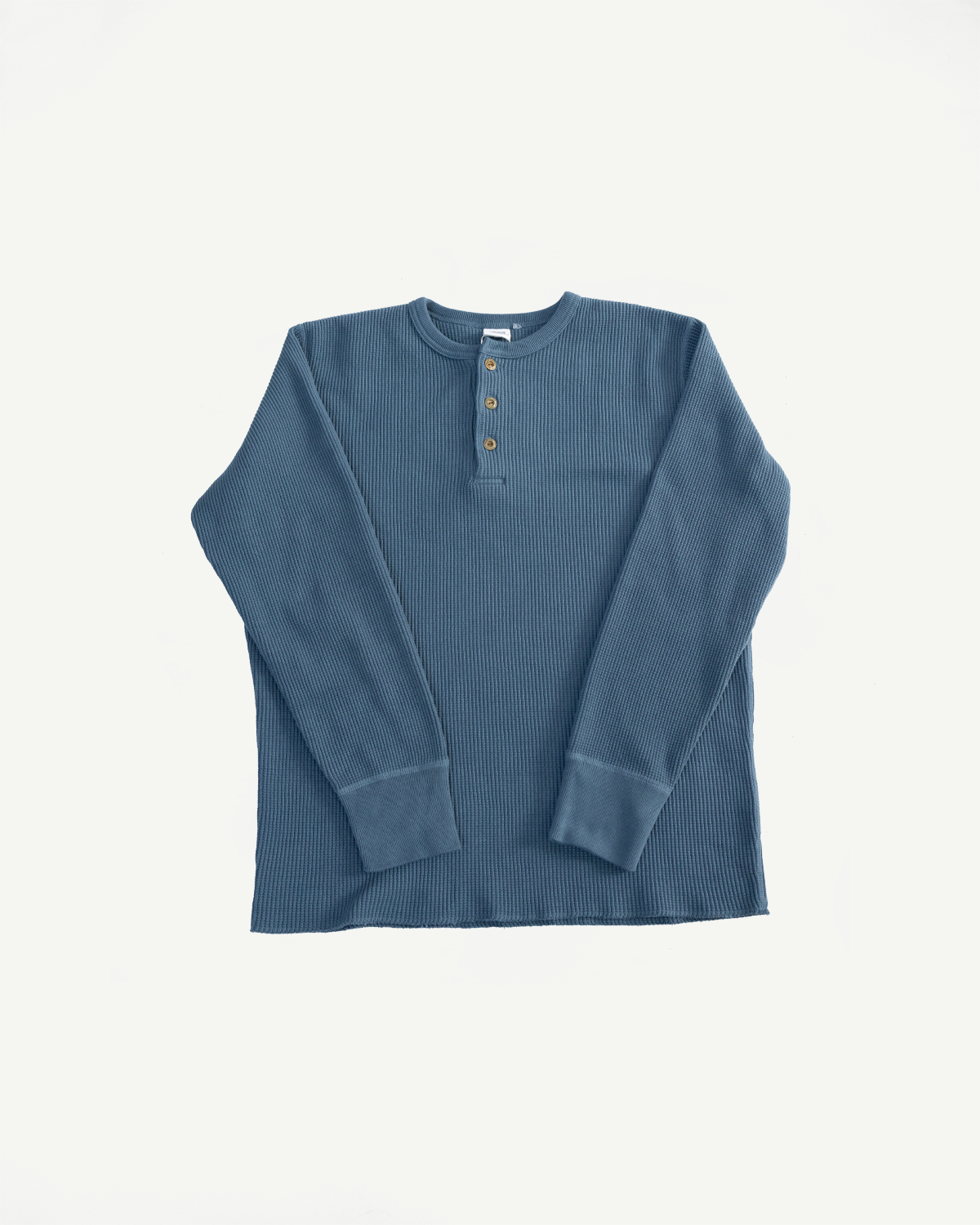 Flat lay of Studio D’Artisan 9937 heavy thermal blue Henley, front view showing long sleeves, three-button placket, and textured ribbed knit.