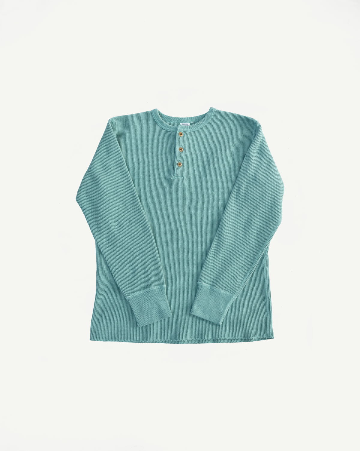 Front flat lay of Studio D'Artisan 9937 emerald heavy thermal long sleeve henley, ribbed texture, button collar detail.