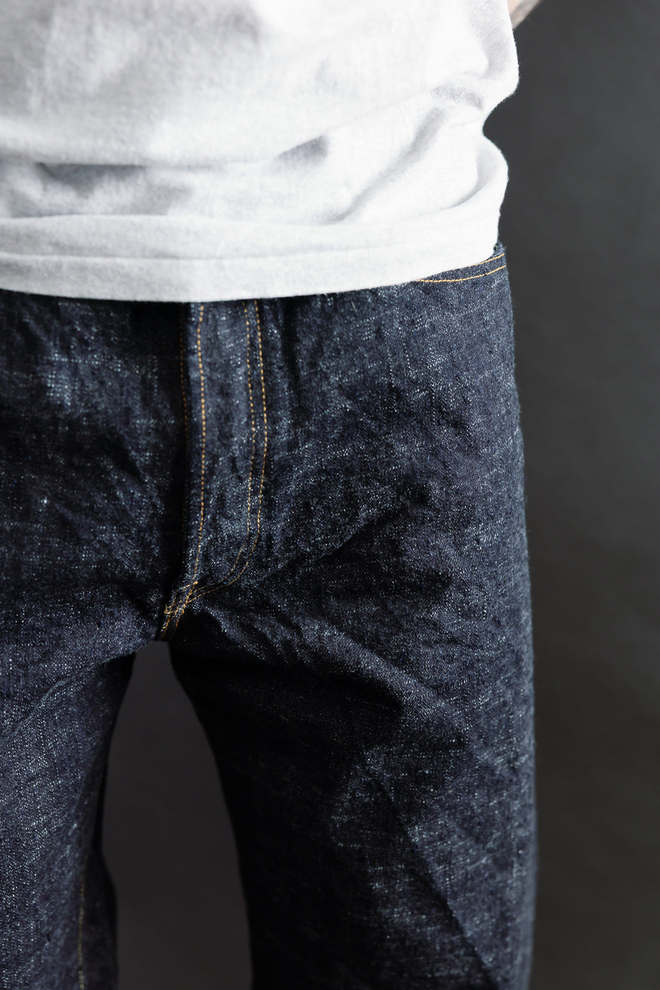 Close-up front view of men's selvedge jeans upper thigh area on 5'9