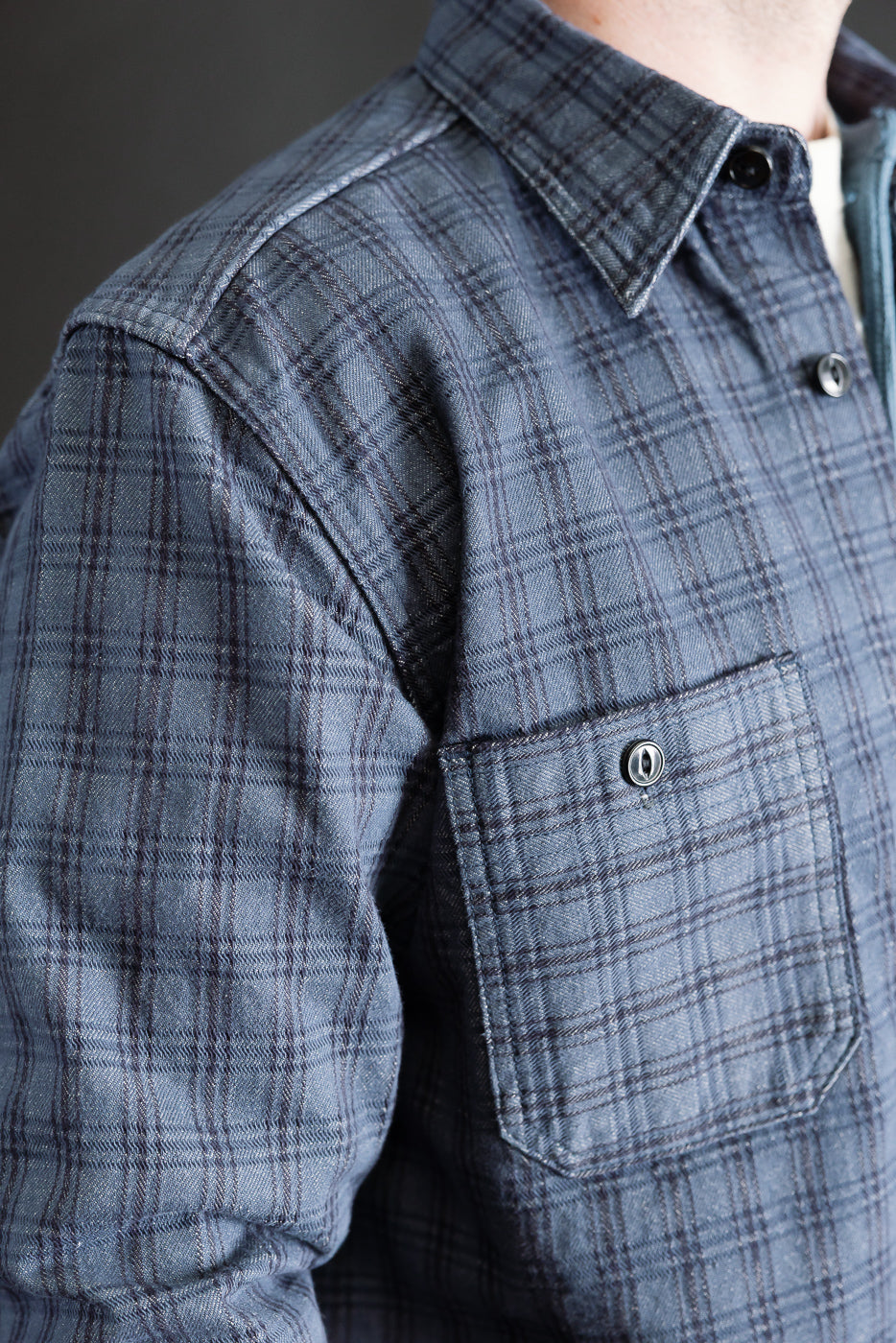 Close-up of Studio D'Artisan 13oz jacquard check work shirt front left chest, pocket, and collar, shown on a 5'9